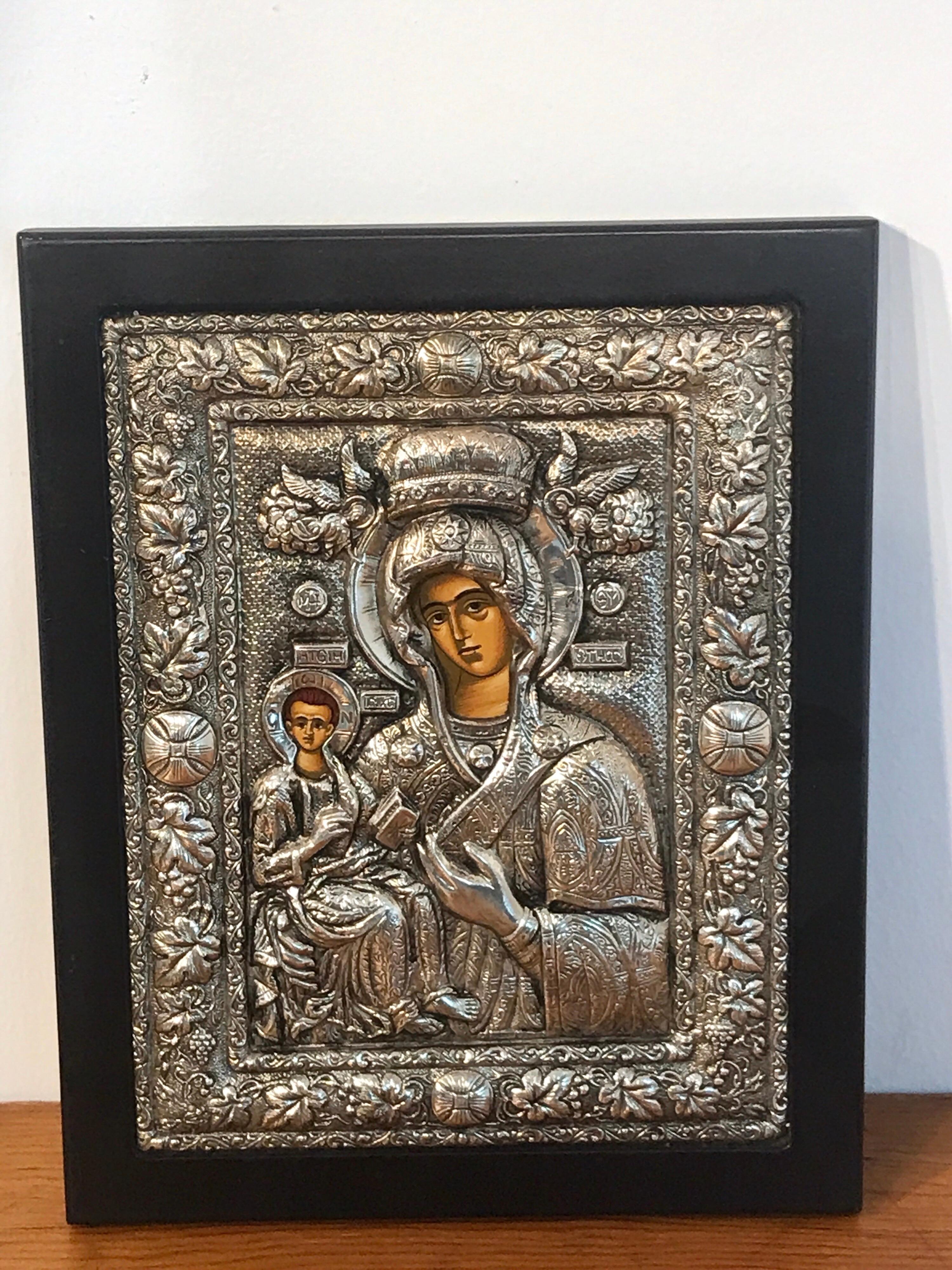 Russian silver Riza icon of Madonna and child, with finely repoused riza, hand painted portraits. The icon measures 7