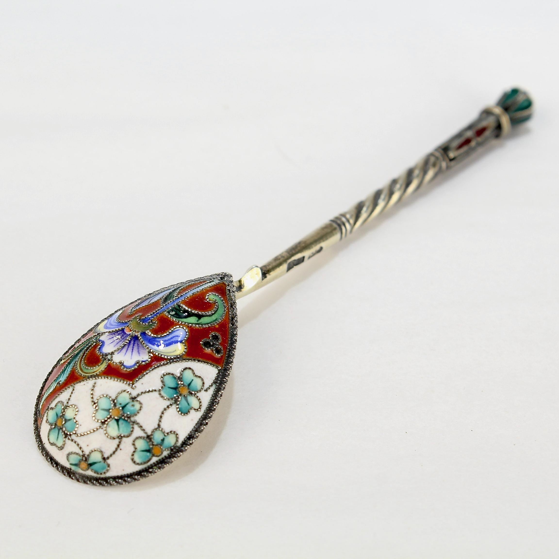 A very fine antique Russian tea or kvosh spoon..

By Maria Sokolova.

With polychrome shaded cloisonné enamel decoration to both the front and reverse.

Simply a wonderful piece of Imperial Russian silver!

Date:
Late 19th or Early 20th
