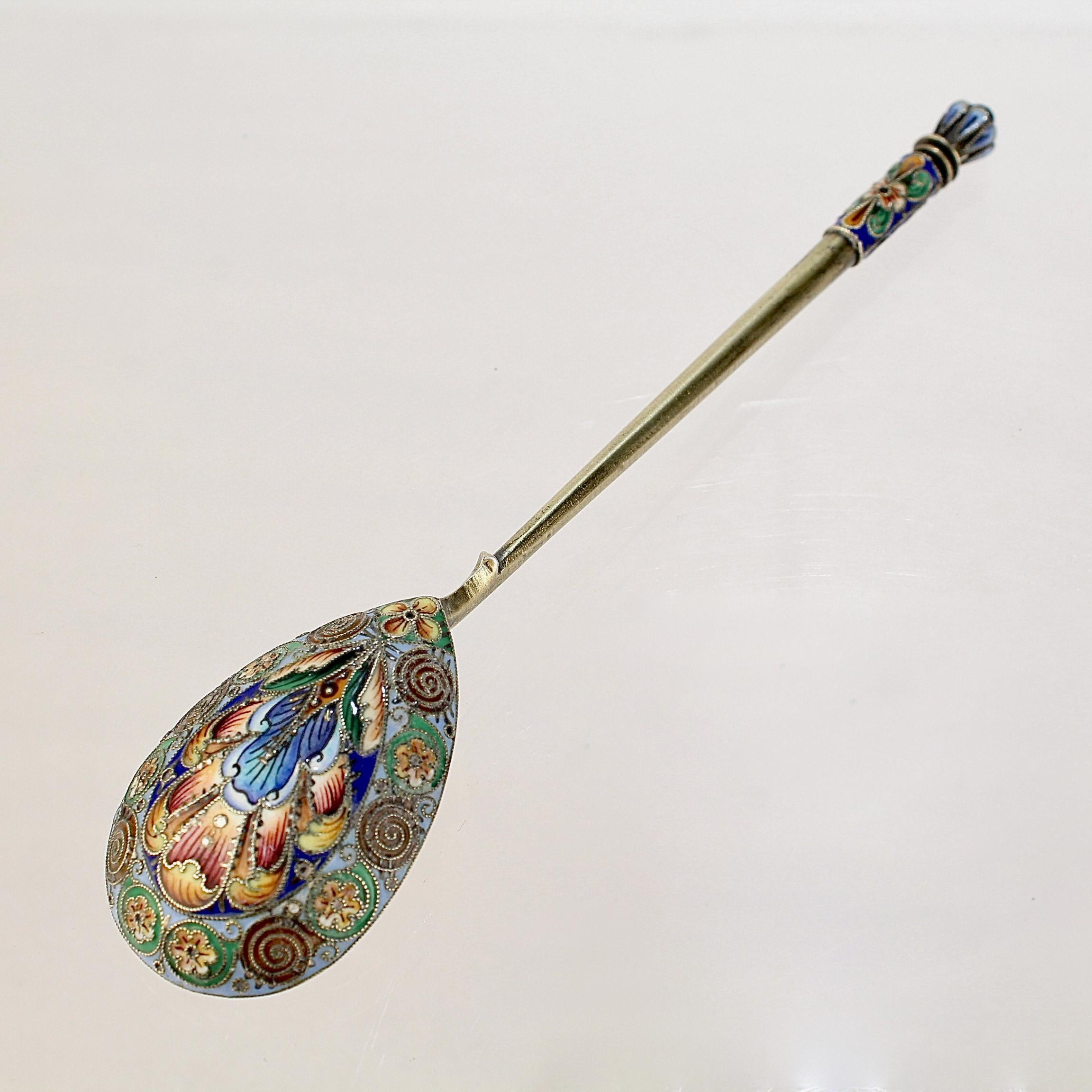 A very fine antique Russian tea or kvosh spoon.

By Maria Sokolova.

With polychrome shaded cloisonné enamel decoration to both the front and reverse.

Simply a wonderful piece of Imperial Russian silver!

Date:
Late 19th or Early 20th