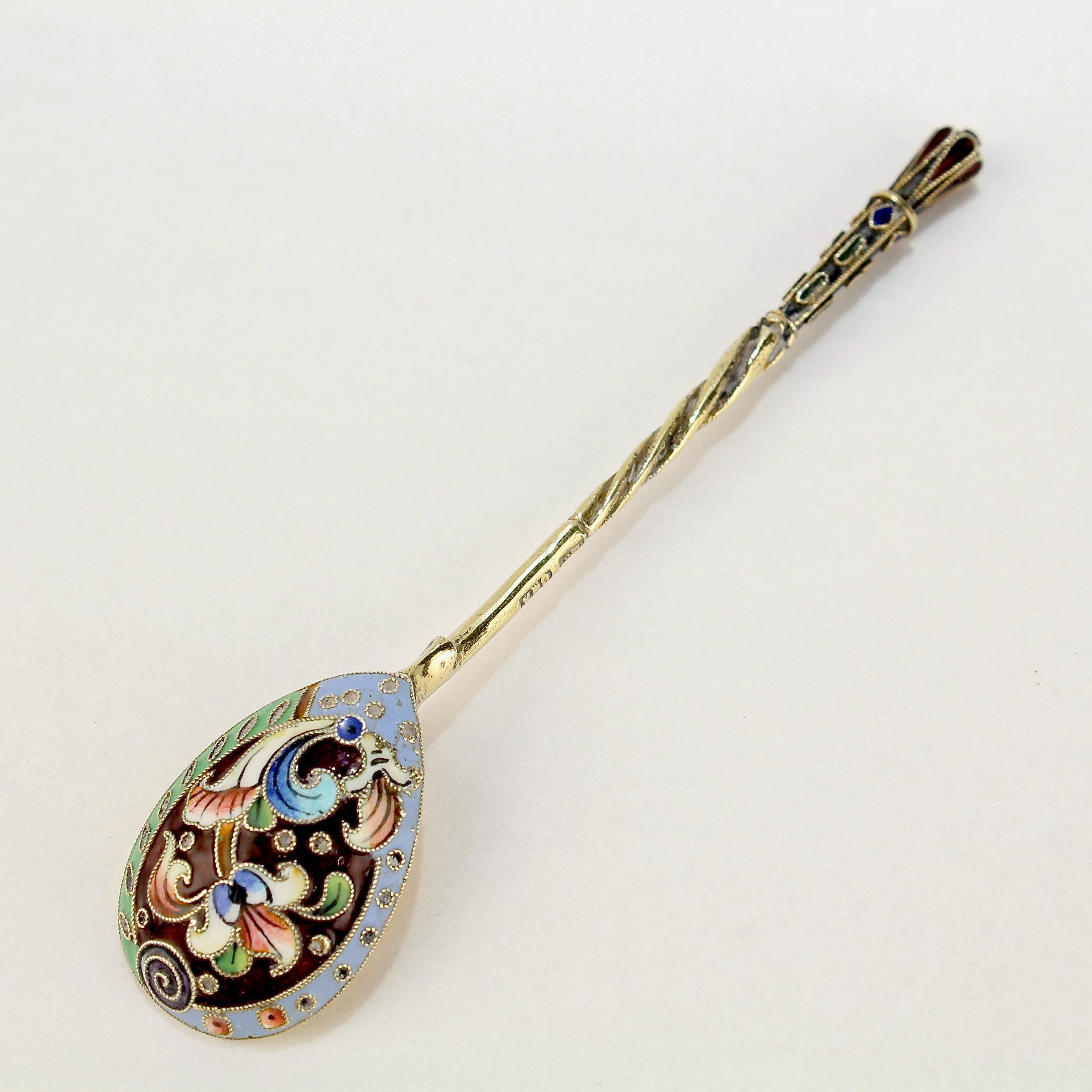 A very fine antique Russian tea or kvosh spoon.

Possibly by Vasily M. Ashmarin. (The maker's mark is partly obliterated).

With polychrome shaded cloisonné enamel decoration to both the front and reverse.

Simply a wonderful piece of Imperial