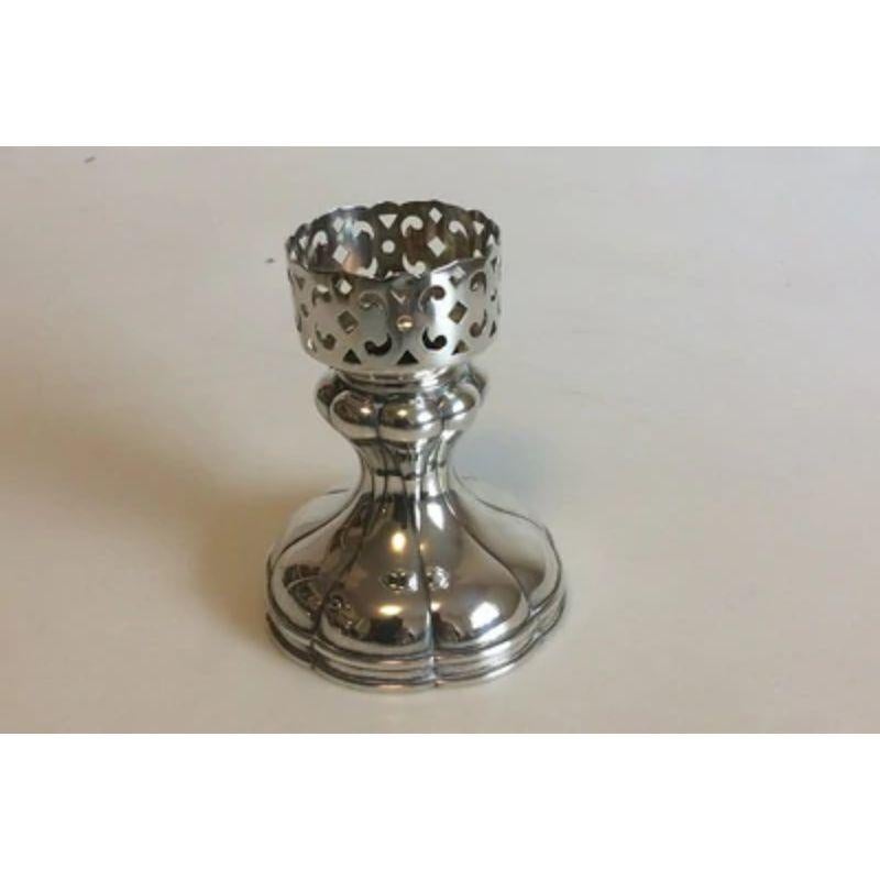 Russian silver stamped IS (in Cyrillic) foot or holder for candlelight.

Measures 11 cm / 4 21/64 in. Weighs 160 g / 5.65 oz.