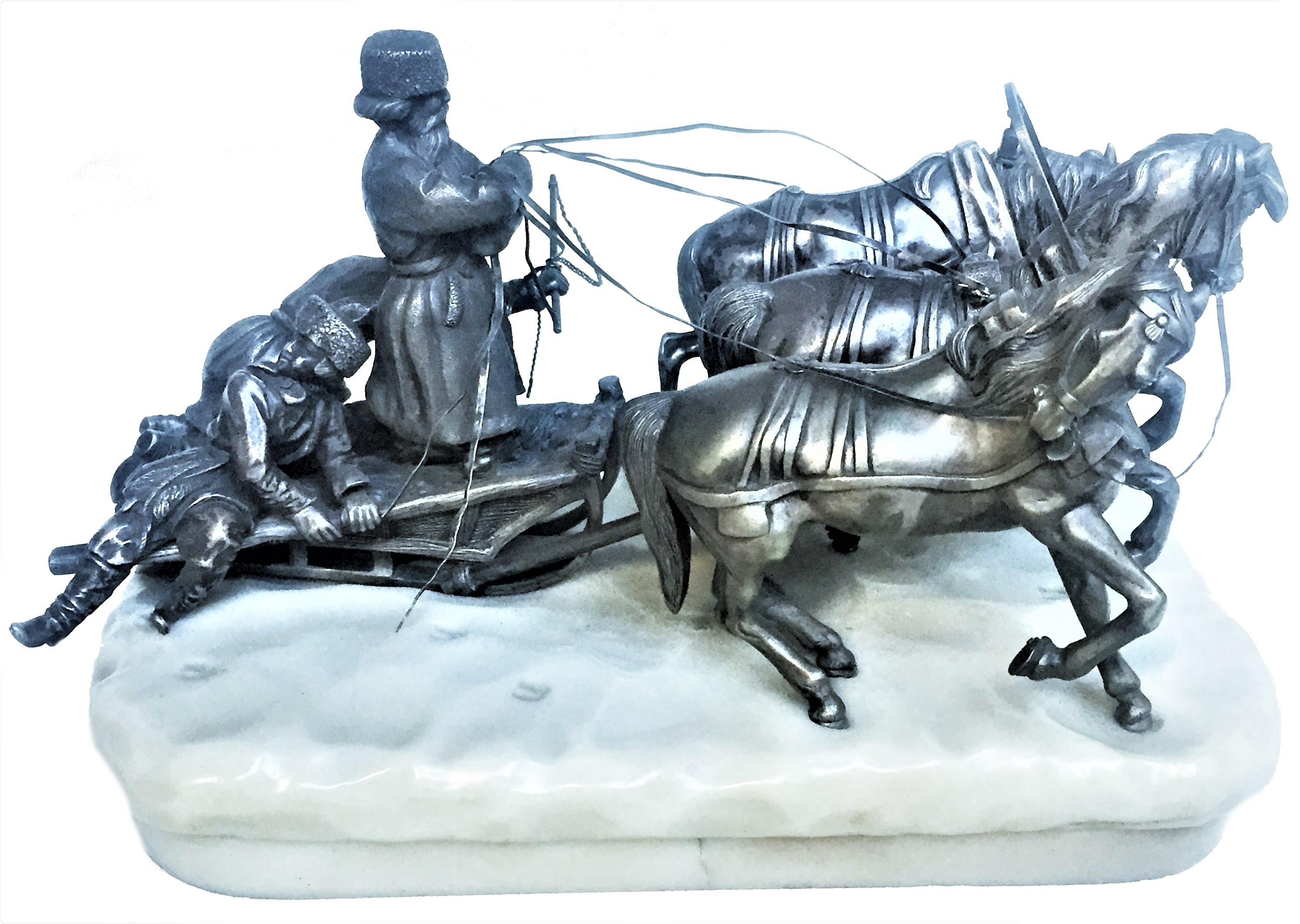 The sculpture depicts an elderly peasant, standing to his full height with reins in his hands; behind him in a sleigh are his son and grandson, who drives the horses with a whip. Dressed in typical peasant clothes, all three have very expressive