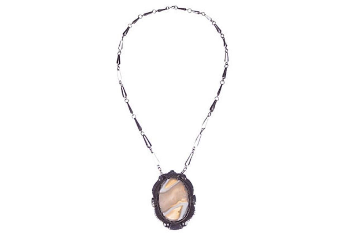 Russian sterling silver agate necklace. Chain, 21 1/2”L x 1/8”W; pendant, 2 7/8” by 2”. Marked: “916” for sterling silver content. Spring clasp and jump ring closure. Weighs: 45.9 grams. No artist's signature.
