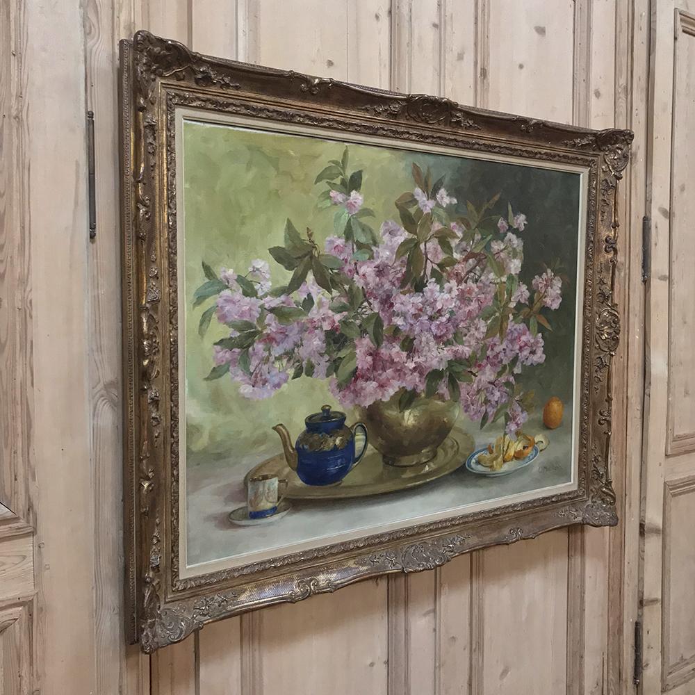 This antique Russian still life showcases a brass vase of cherry flowers and oranges in the brilliant soft hues of pink and orange, set on a tray with tea pot. We discovered this art on our European buying trip and we immediately loved the charming
