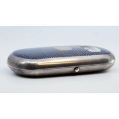 Russian-style elliptical silver cigarette case with gold interior