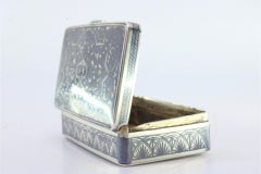 Russian-style silver snuff box with floral scrolls and gold interior