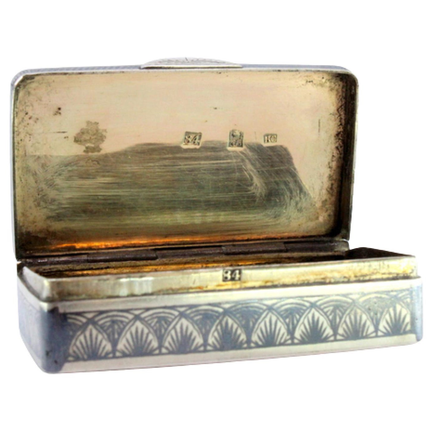Russian-style silver snuff box with floral scrolls and gold interior