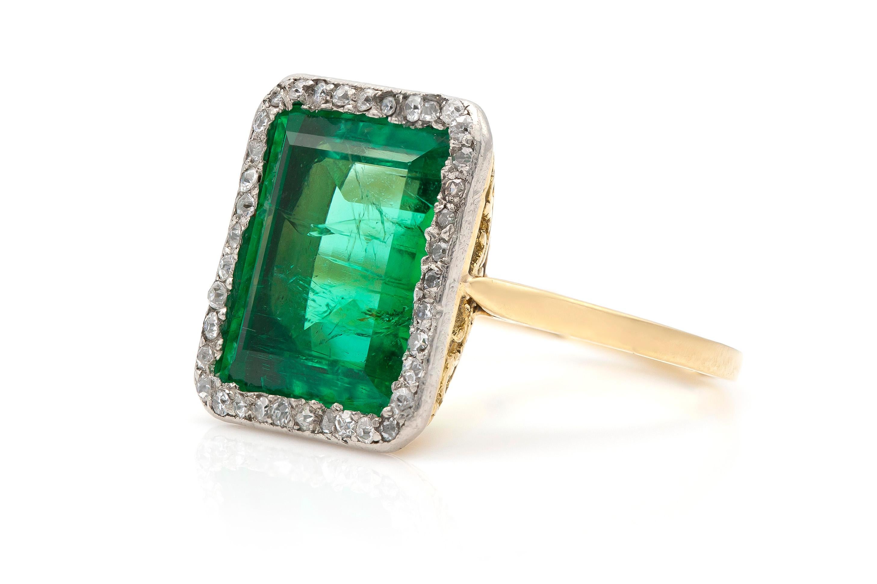 Finely crafted in yellow gold and platinum with a center Russian Emerald from Ural Mountains, weighing 7.20 carats.
The ring features round cut diamonds around the emerald.
Edwardian, circa 1910s.
AGL Certificate available