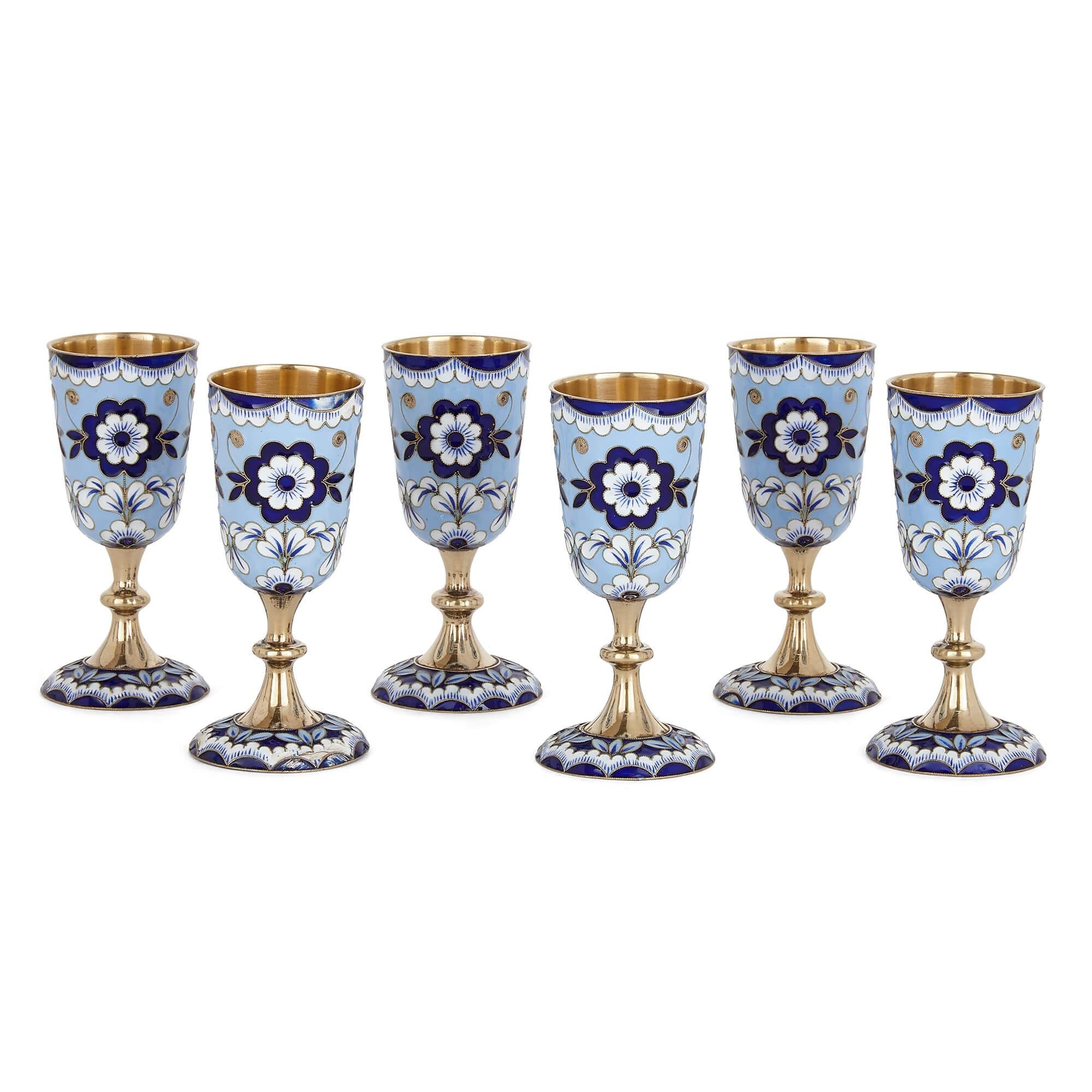 Russian vermeil and blue enamel vodka set
Russian, 20th Century
Decanter: Height 29cm, diameter 8cm
Cup: Height 8.5cm, diameter 4cm

This Russian drinking set was crafted during the Soviet period from cloisonné enamel and vermeil. The set is
