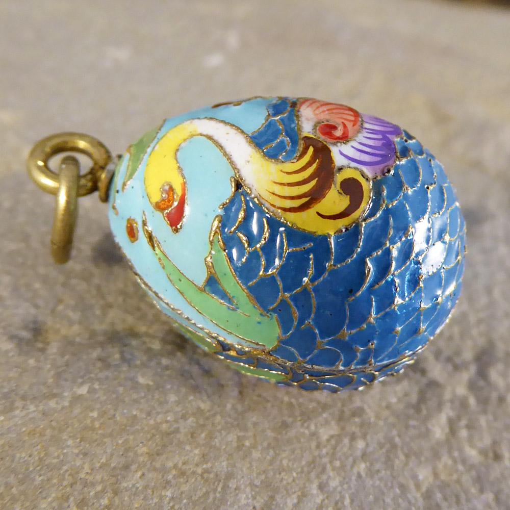 This vintage pendant features a swan design in silver gilt and enamel. Russian in origin, it would make the perfect gift!
It can be worn as a pendant on a chain or as a large charm on a bracelet.

Condition: Very Good, slightest signs of wear due to