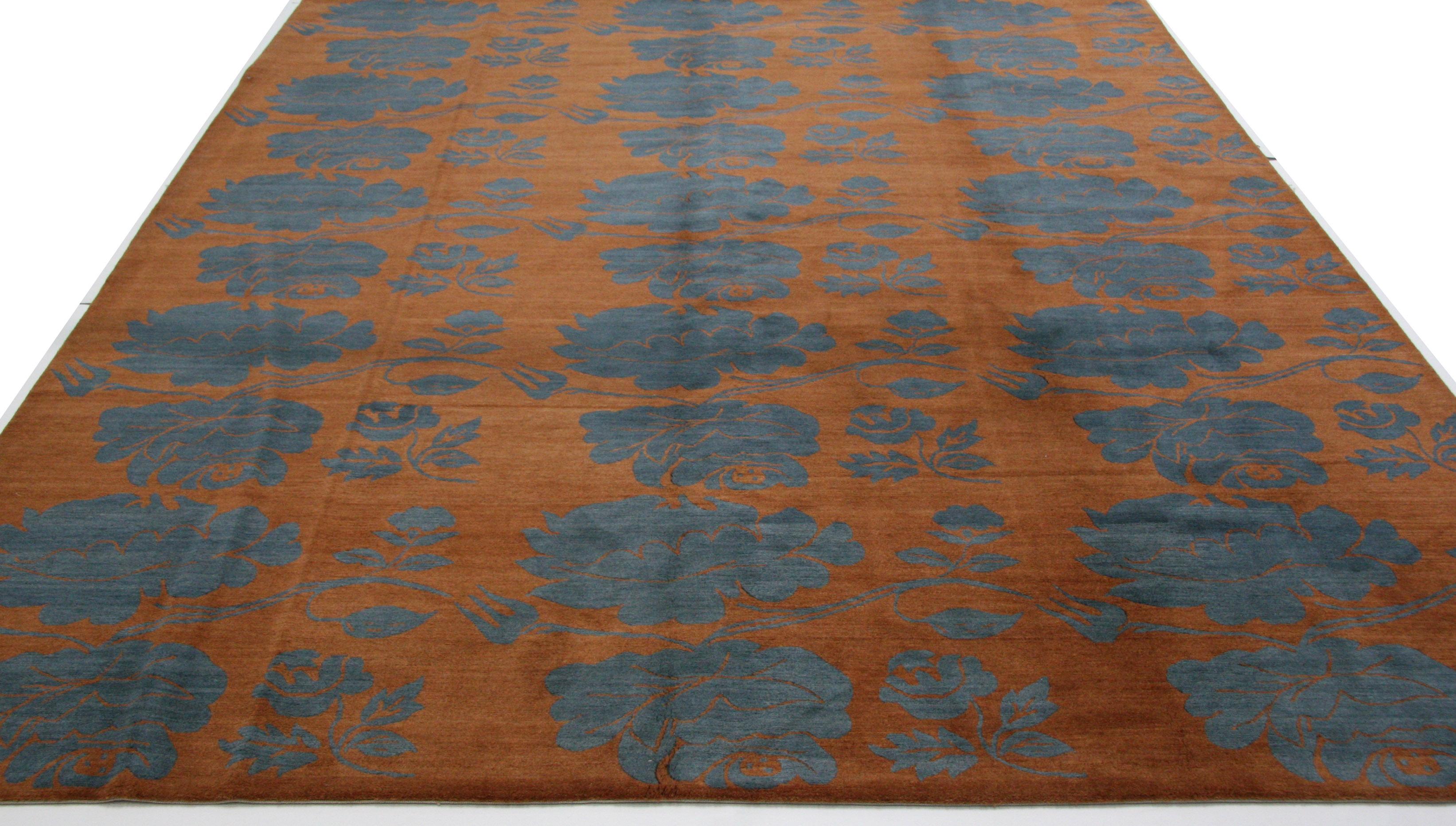 The large swirling blue gray floral pattern gives the impression of an applied design but a closer look reveals a deftly integrated blend of warm and cool colored fibers. All wool construction adds durability to beauty. 

Hand knotted in Nepal