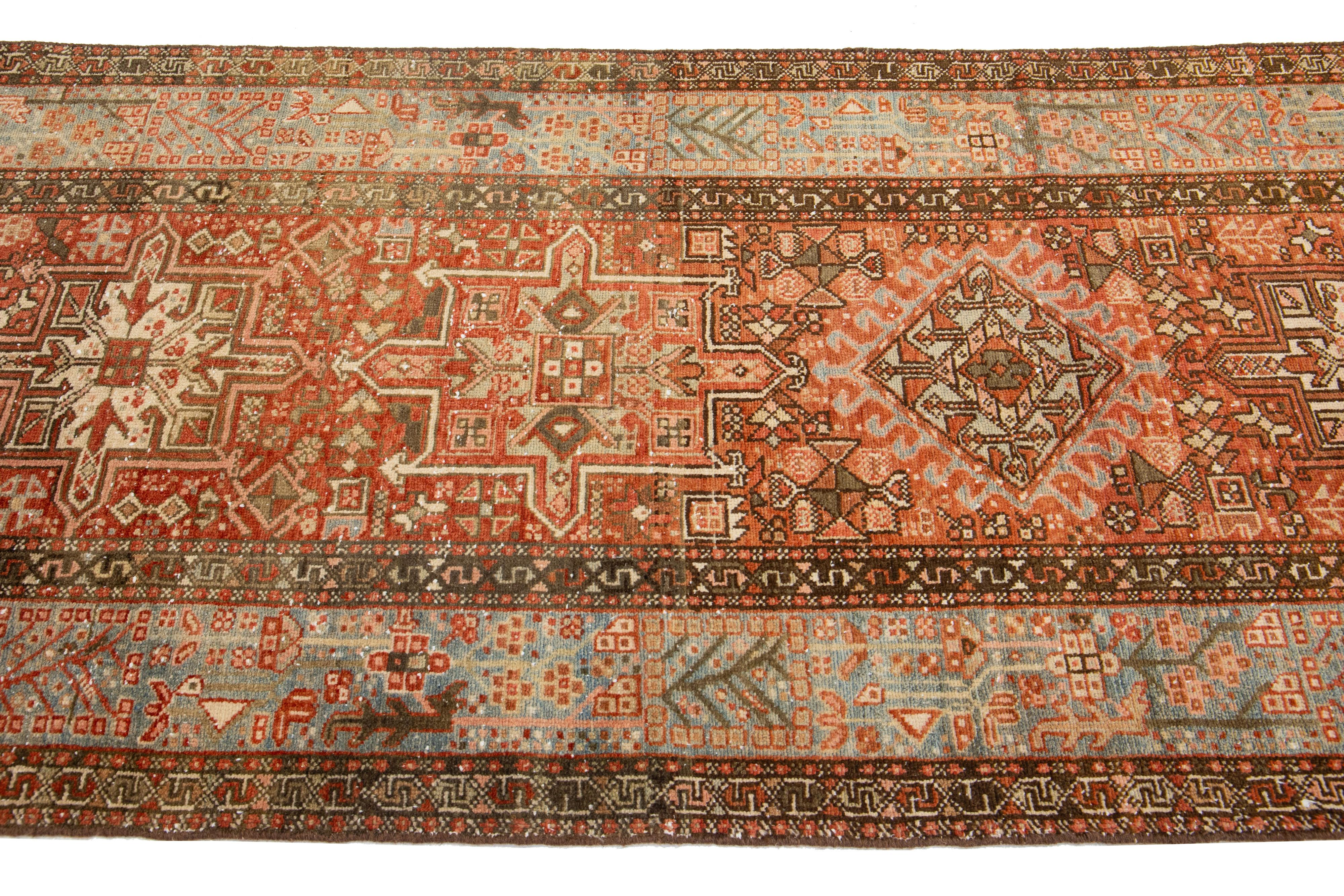 Persian Rust Antique Handmade Heriz Wool Runner With Tribal Design For Sale