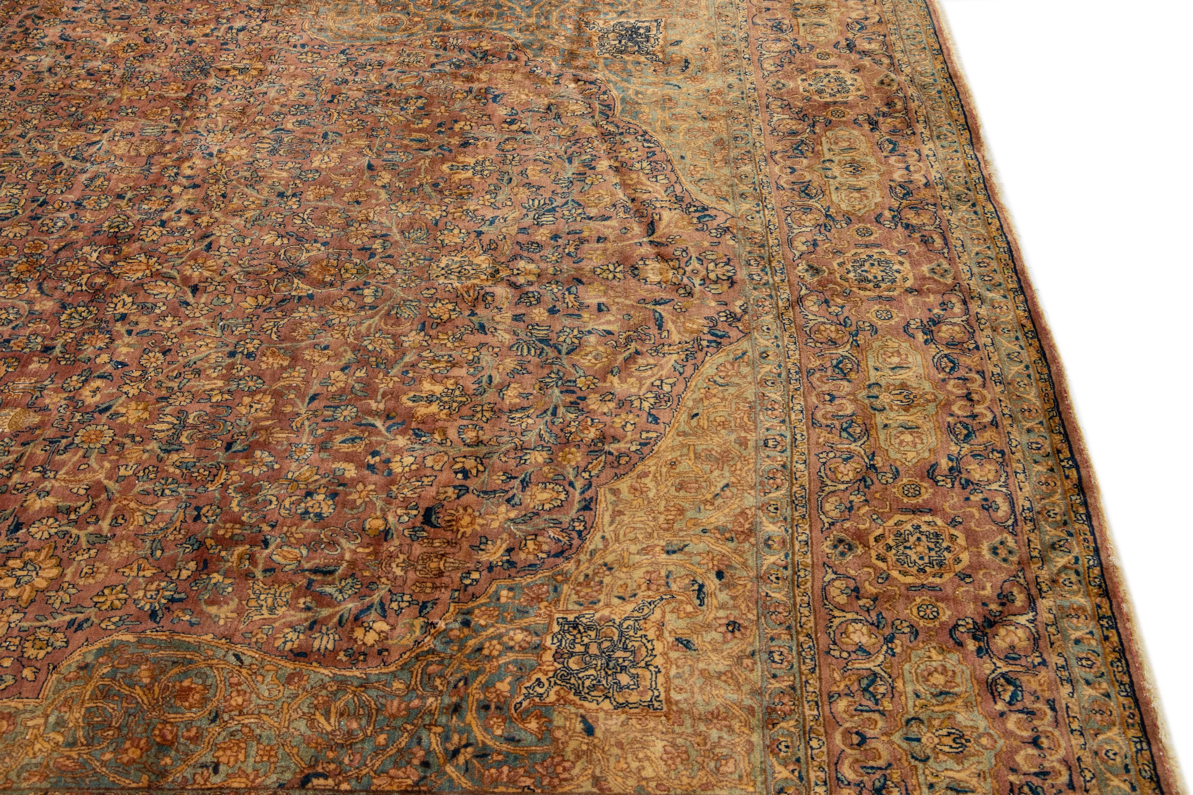 20th Century Rust Antique Kerman Handmade Rosette Designed Persian Wool Rug For Sale