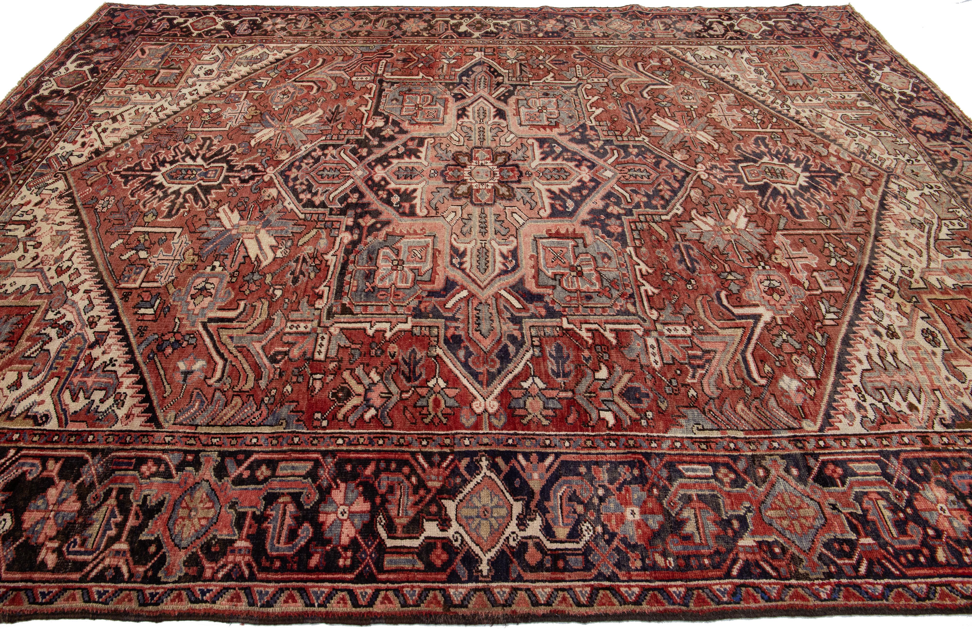 Early 20th Century Rust Antique Persian Heriz Handmade Wool Rug With Medallion Design For Sale