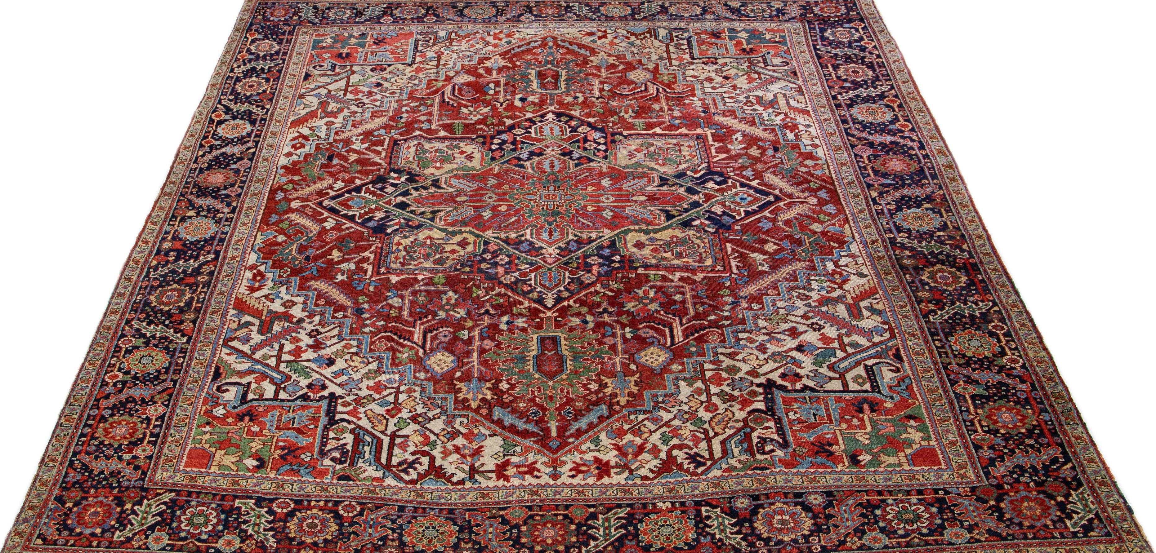 Early 20th Century Rust Antique Persian Heriz Handmade Wool Rug with Multicolor Medallion Design For Sale