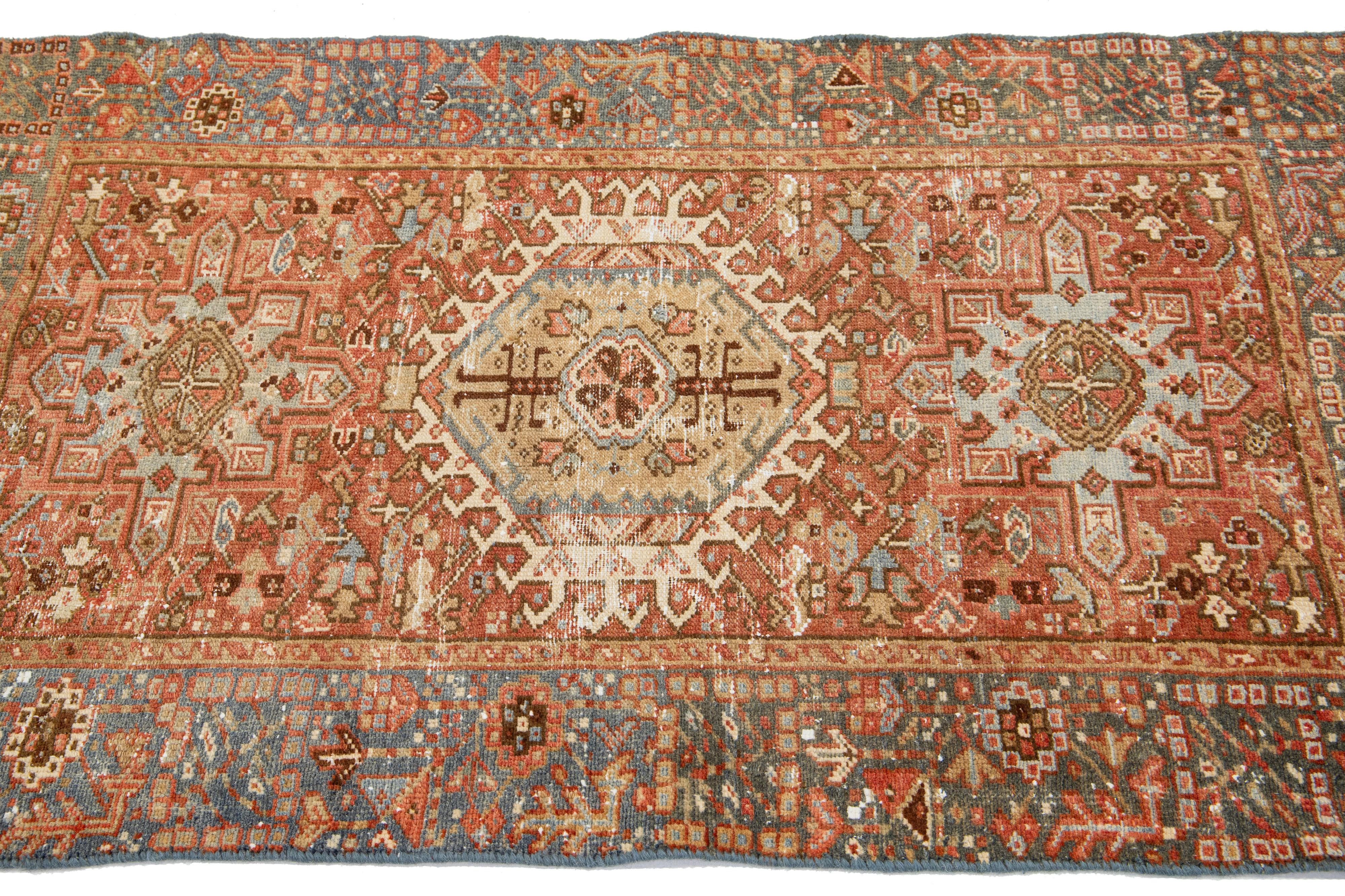 Hand-Knotted Rust Antique Persian Heriz Wool Rug Featuring an Allover Motif For Sale