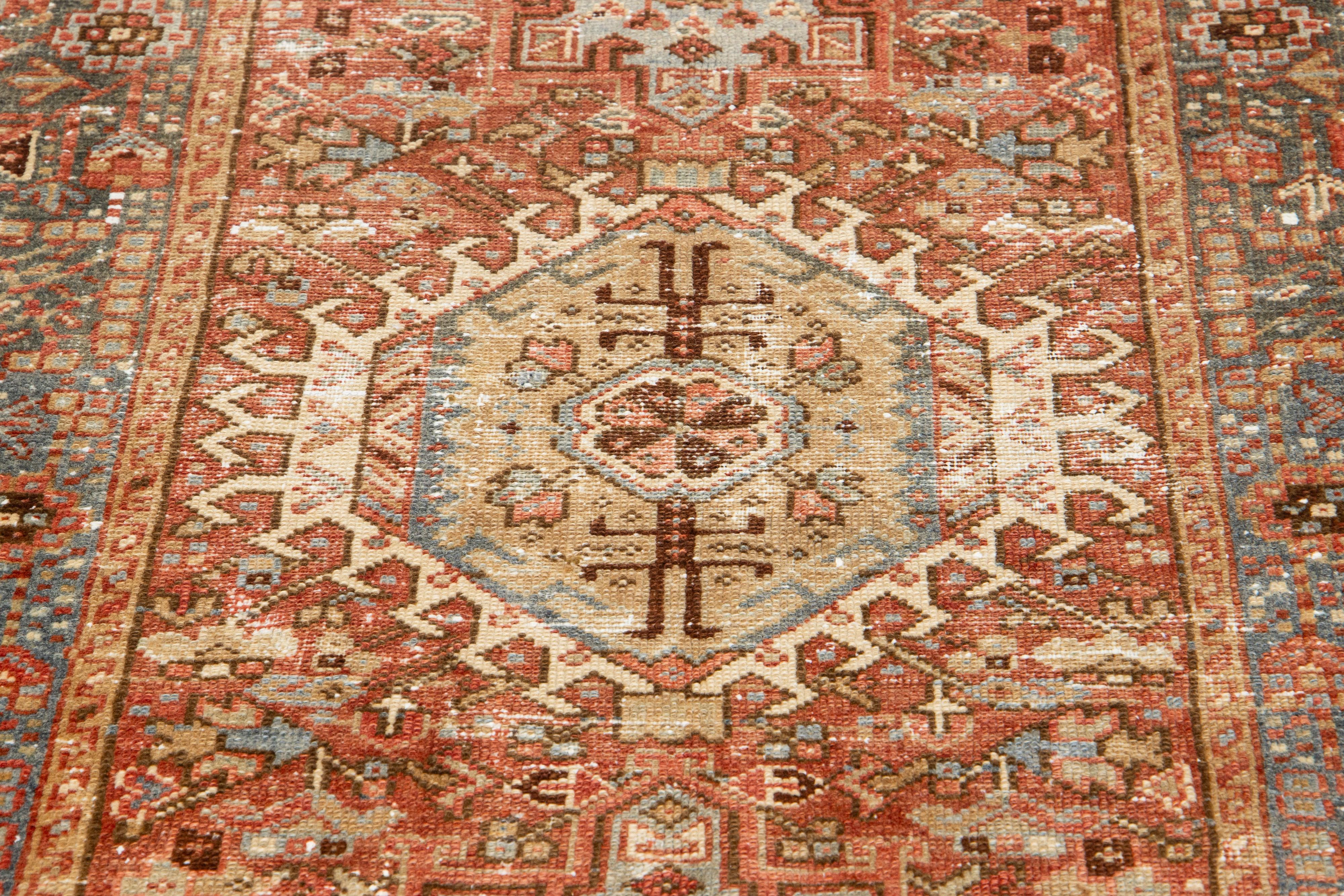 Early 20th Century Rust Antique Persian Heriz Wool Rug Featuring an Allover Motif For Sale