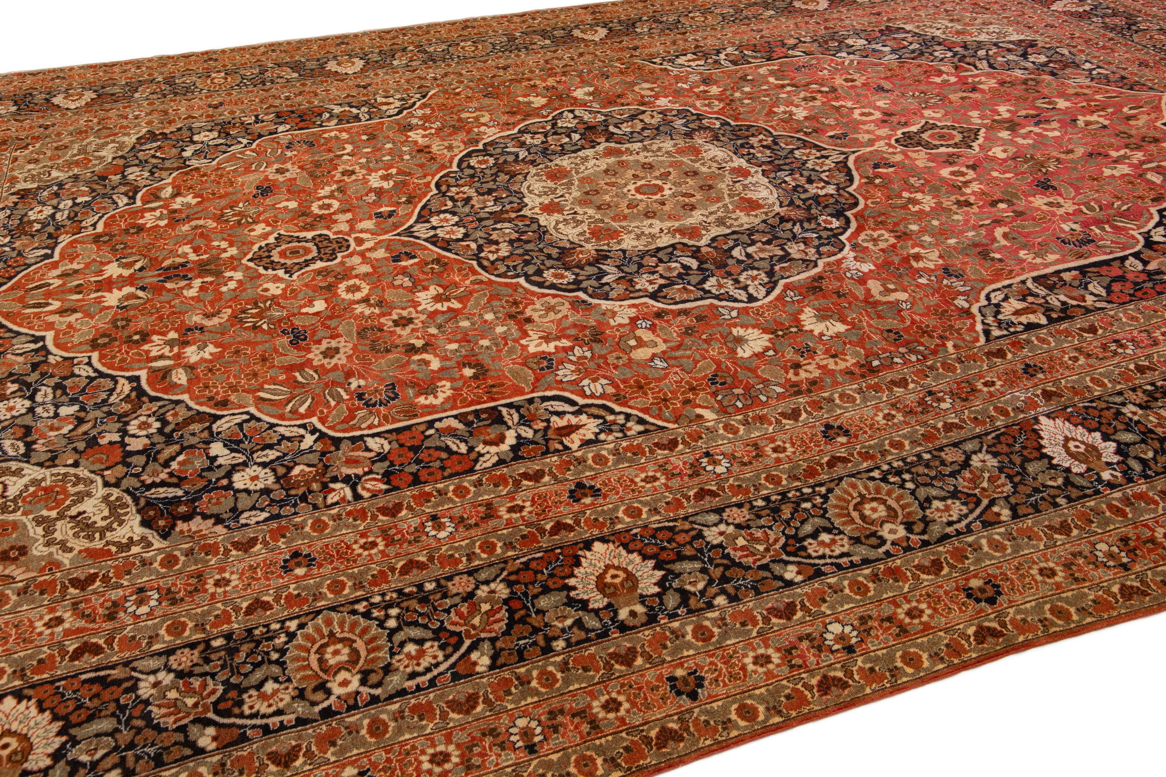 20th Century Rust Antique Tabriz Handmade Persian Wool Rug With Rosette Design For Sale