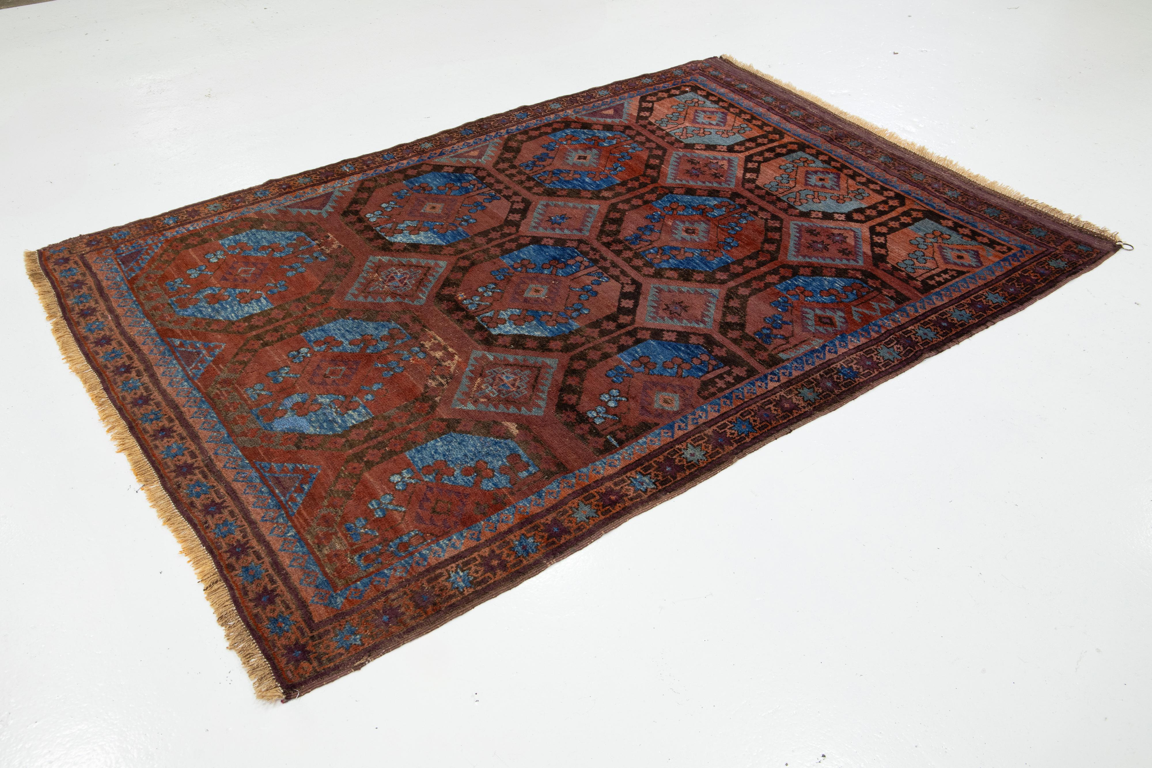 Hand-Knotted Rust Antique Turkmen Persian Wool Rug With Geometric Design For Sale