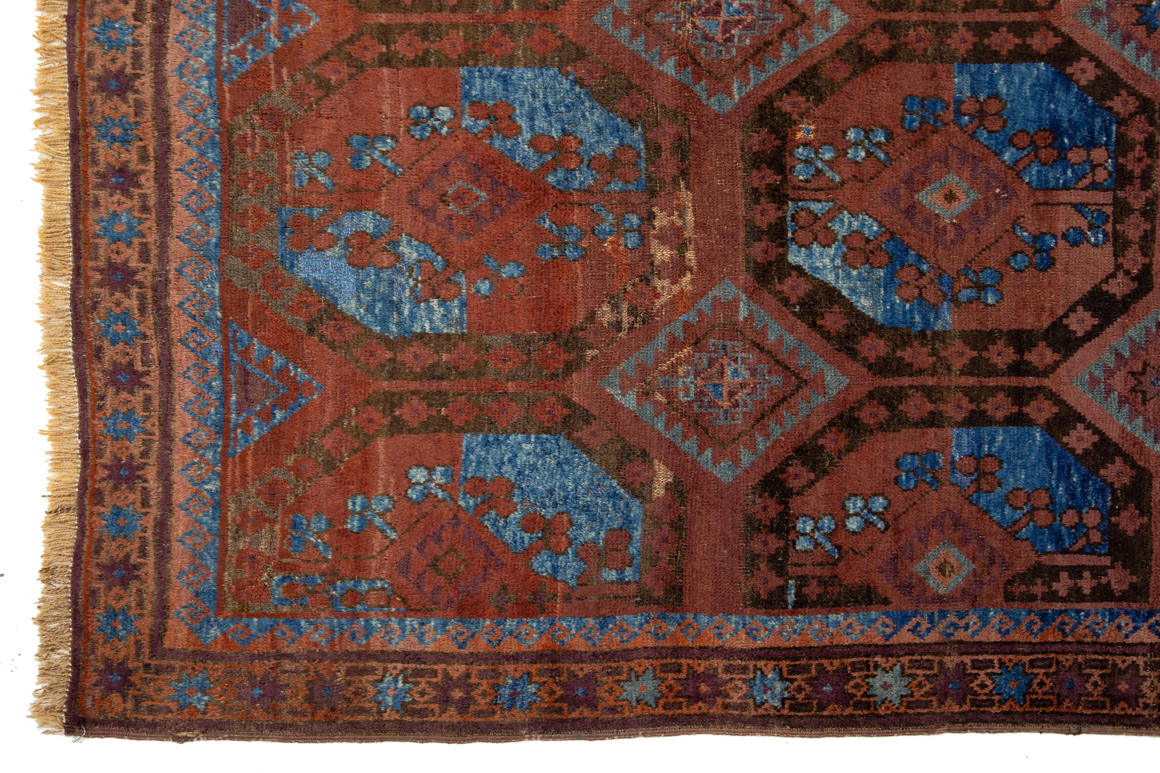 20th Century Rust Antique Turkmen Persian Wool Rug With Geometric Design For Sale