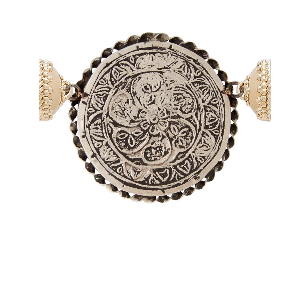 Hand-painted from Jaipur, steeped in legend. Displays Ganesh, the elephant-headed Hindu god of beginnings and the patron of intellectuals, scribes, and authors. This piece features our 14K plated yellow gold magnetic signature clasps for a modern