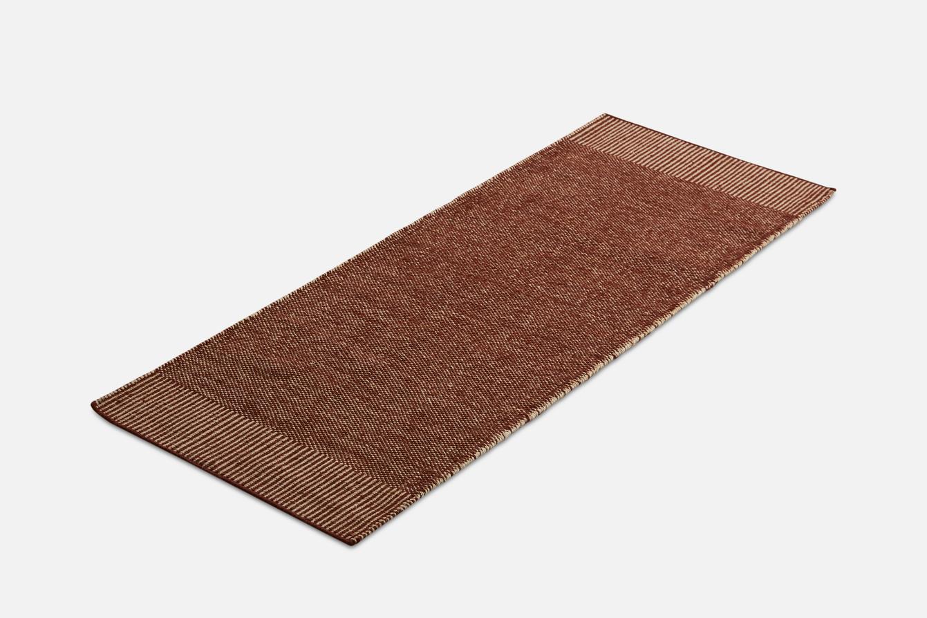 Rust Rombo runner rug by Studio MLR
Materials: 65% wool, 35% jute.
Dimensions: W 75 x L 200 cm
Available in 3 sizes: W 90 x L 140, W 170 x L 240, W 75 x L 200 cm.
Available in grey, moss green and rust.

Rombo is characterised by the materials