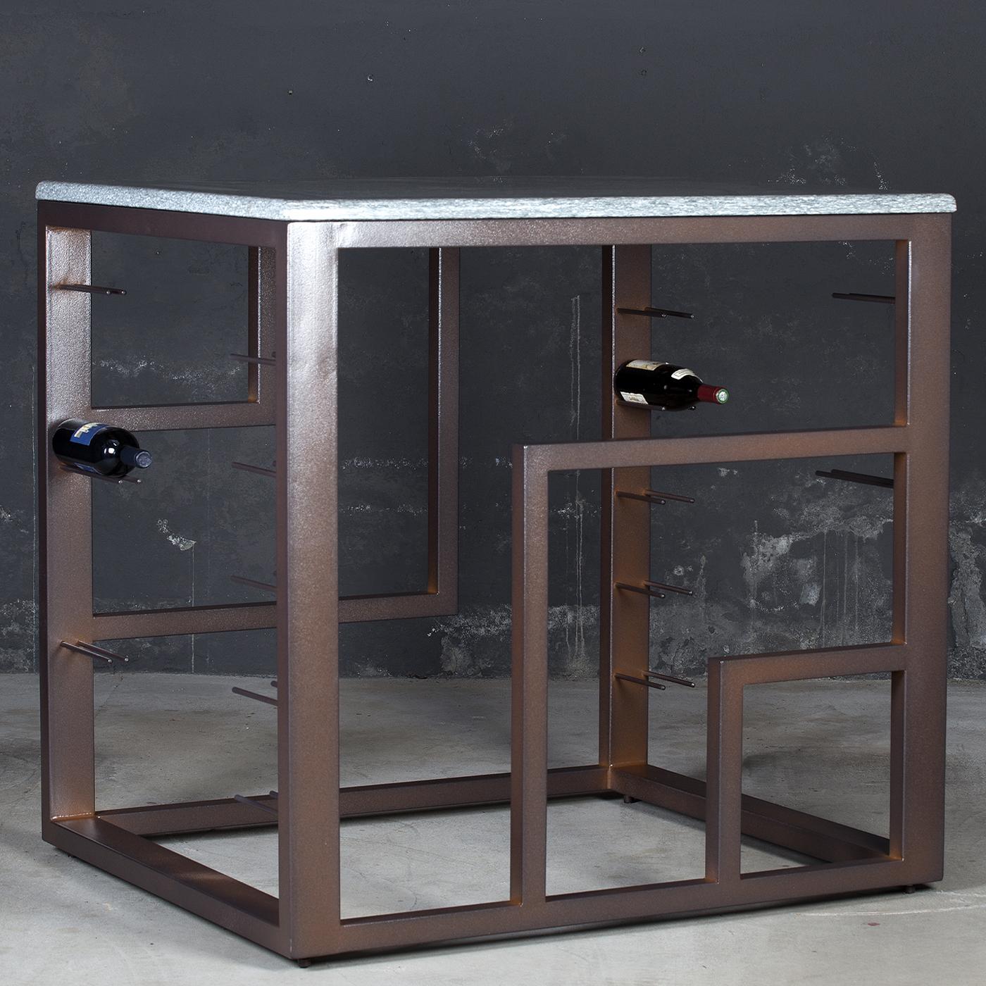 An exquisite design piece suitable for both indoor and outdoor use, this table and wine rack is entirely handmade of stainless steel. Hosting up to two sets of glasses and 10 bottles, it is sanded and lacquered with a rusty paint that adds to its