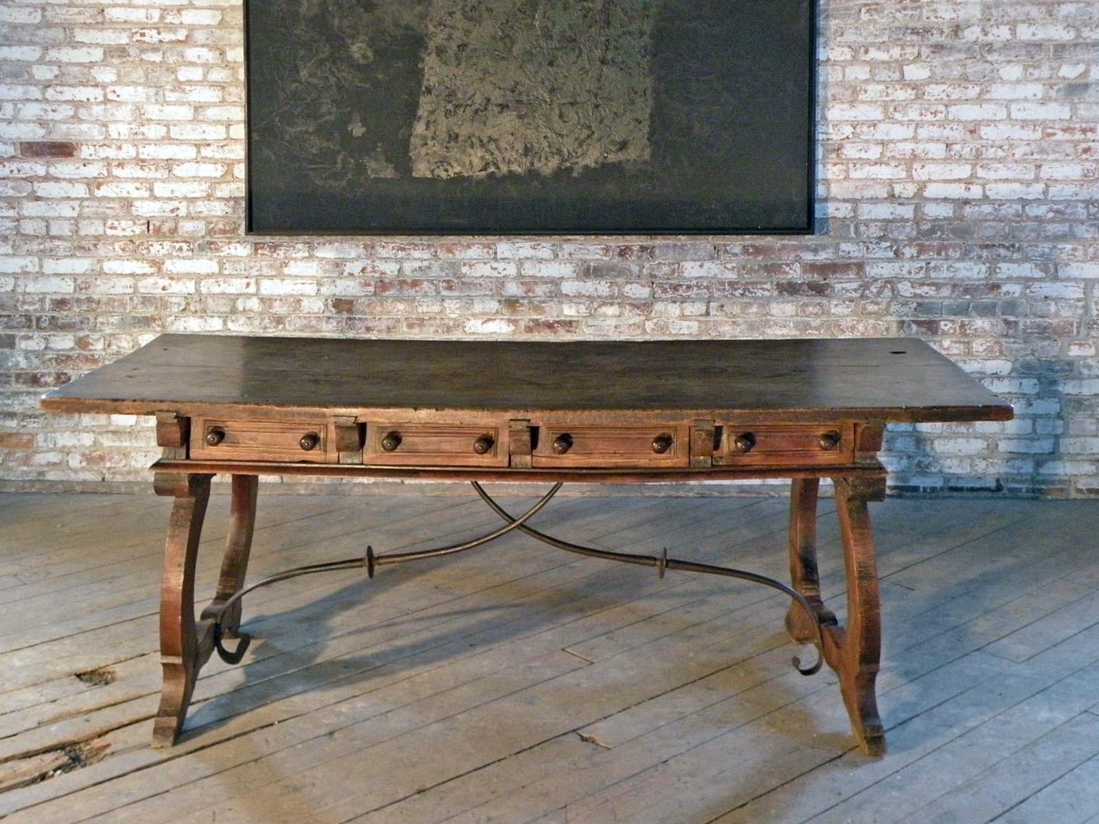 17th Century Baroque Walnut Desk / Writing or Library Table, with a thick walnut one-plank top above a frieze containing four drawers with molded, paneled fronts and wooden pulls supported by very unique, beautifully shaped lyra-form legs, connected