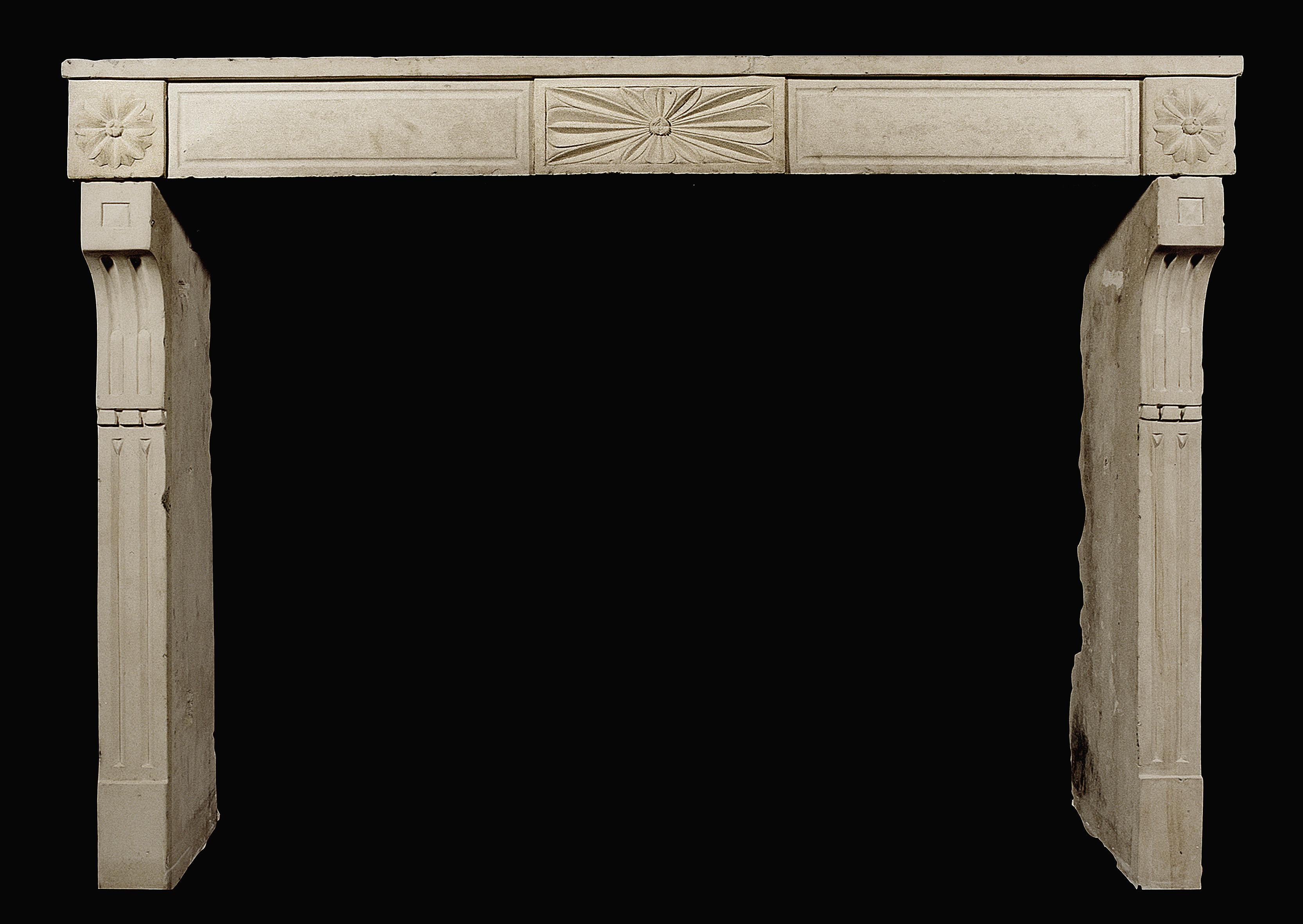 An 18th century French Louis XVI stone fireplace with sunburst centre blocking, and shaped fluted jambs.

Measures: 
Shelf Width:	1550 mm      	61 in
Overall Height:	1130 mm      	44 1/2 in
Opening Height:	970 mm      	38 1/4 in
Opening Width:	1310