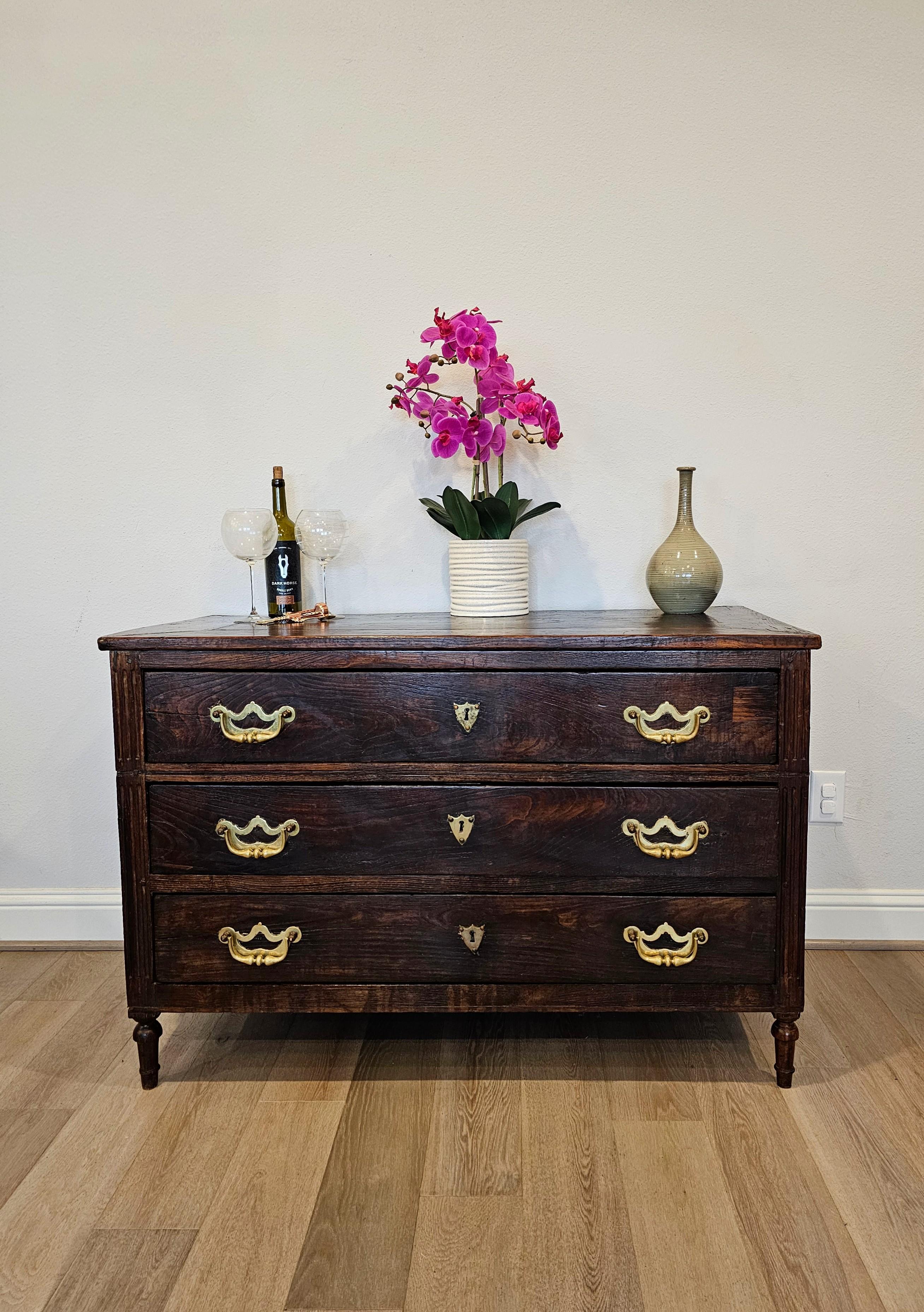 A handsome rustic antique Italian walnut chest of drawers commode. circa 1780

Hand-made in Italy in the second half of the 18th century, styled in Neoclassical inspired Louis XVI period taste, having a rectangular boarded top, over solid wood case