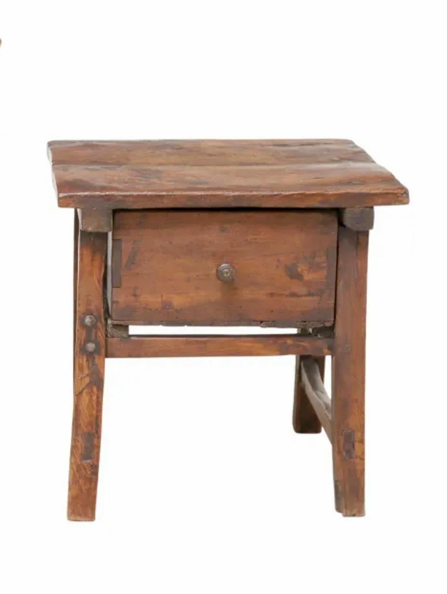 A rustic antique Spanish Colonial Baroque style walnut low table with beautifully aged warm distressed patina. 

Born in the second half of 18th century, primitive hand-crafted mortised solid walnut construction, having a rectangular two board