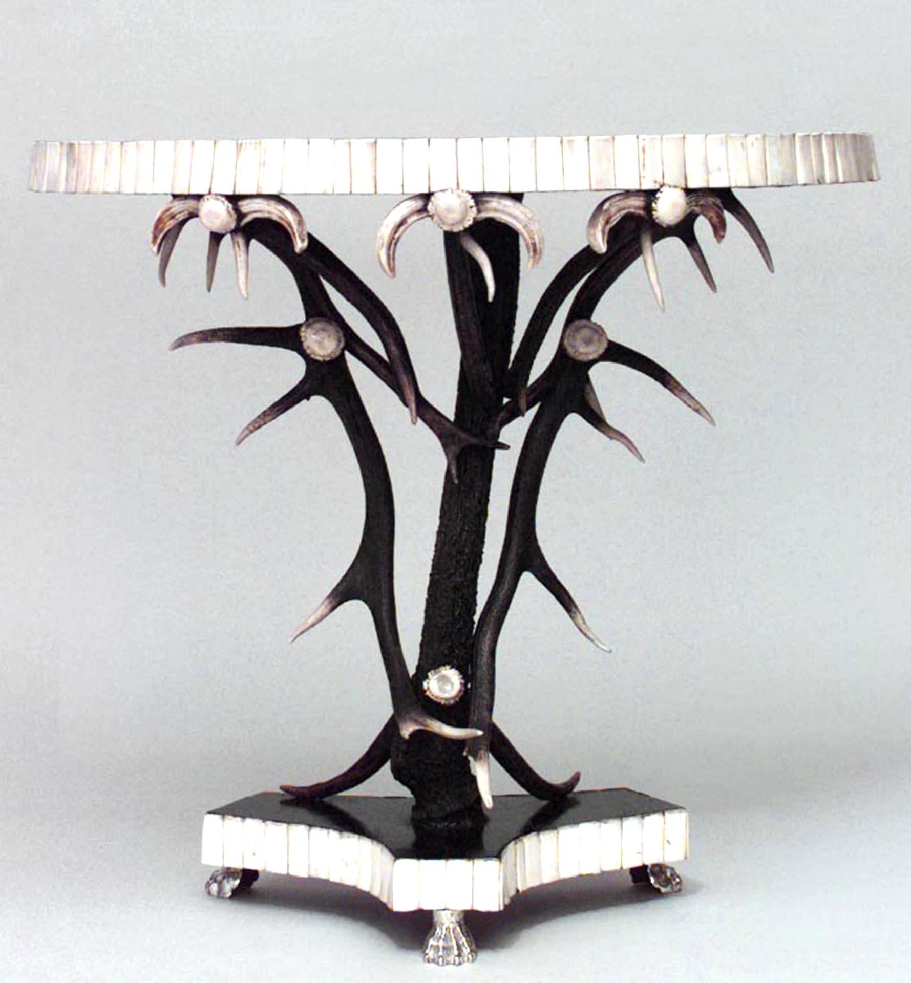 Rustic Continental (20th Century) antler design and ebonized half round console table with bone trim having a triangular base with 3 silvered claw feet.
