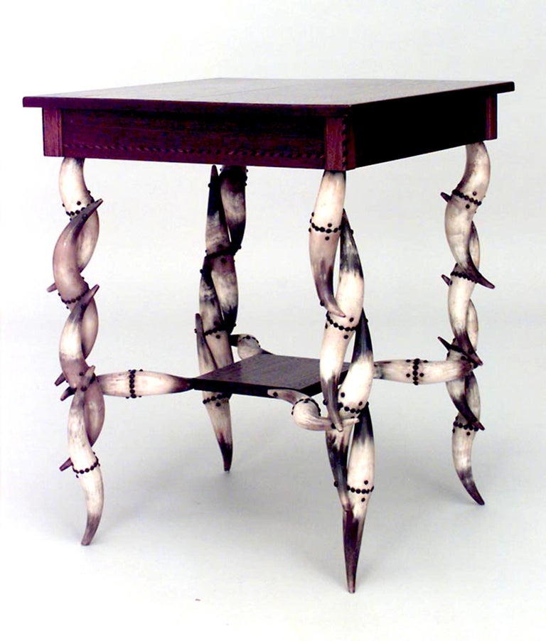 Rustic Continental (19th Century) square end table with inlaid trimmed top & shelf and steer horn design legs.

