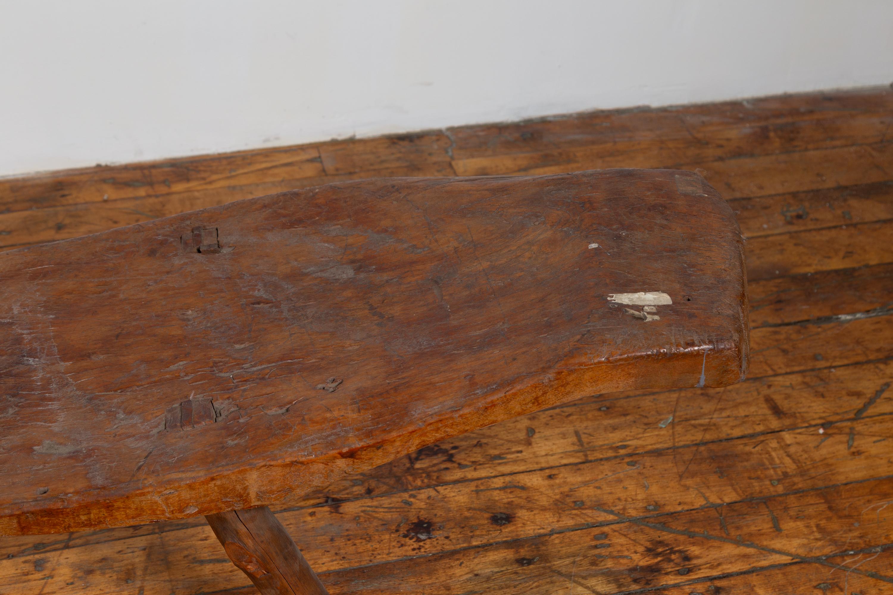 Rustic 19th Century Freeform Javanese Wooden Bench with Weathered Patina In Fair Condition In Yonkers, NY