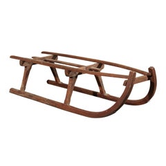 Retro Rustic 19th Century French Wooden Sled with Weathered Patina and Curving Base