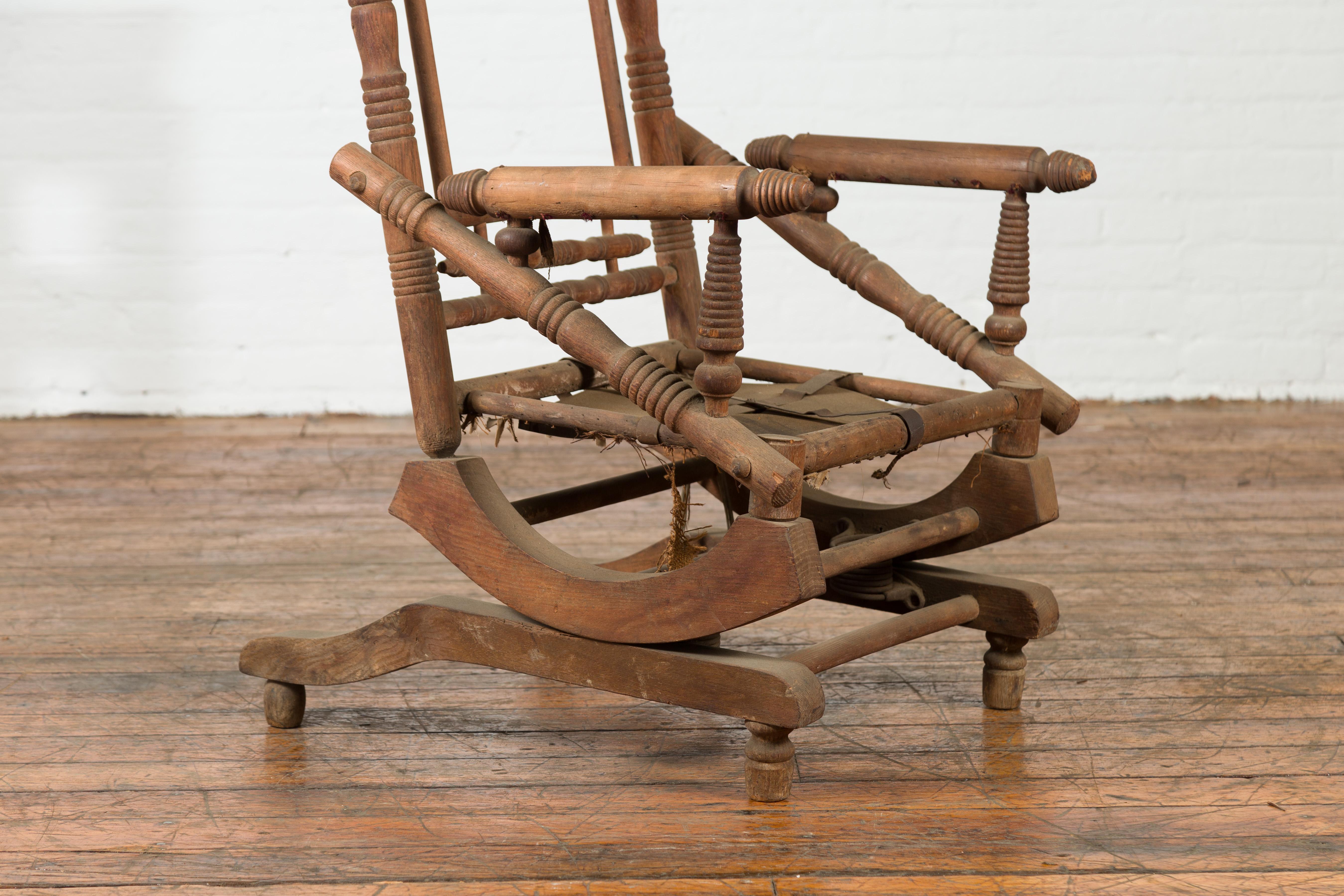 Rustic 19th Century Indian Rocking Chair with Metal Accents and Turned Supports For Sale 1