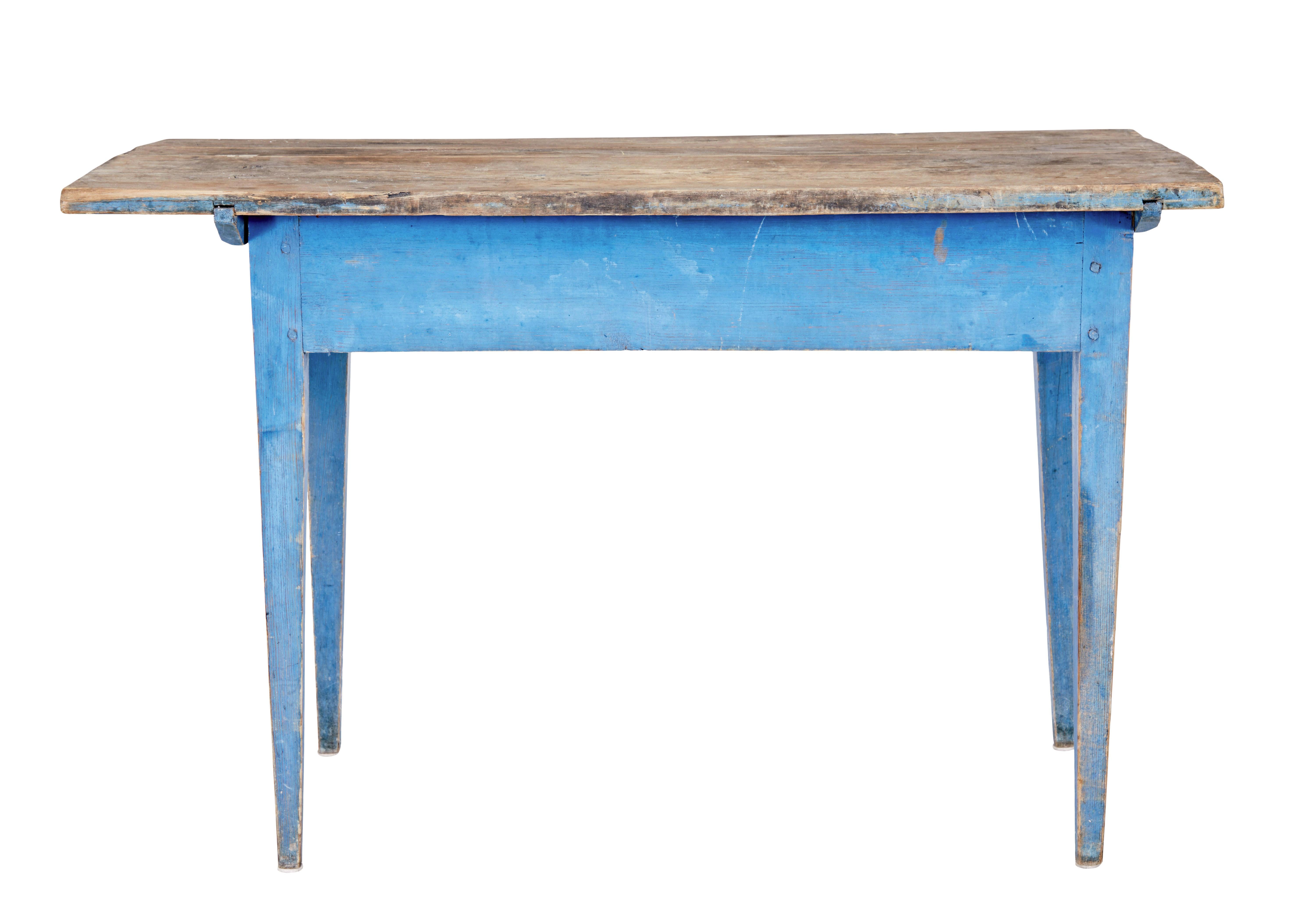 Rustic 19th century painted pine side table circa 1860.

Rustic swedish pine table with original scrubbed pine top and striking blue painted base.  Ideal for use in a garden room or to place in a modern interior.  Original patina, stands on 4