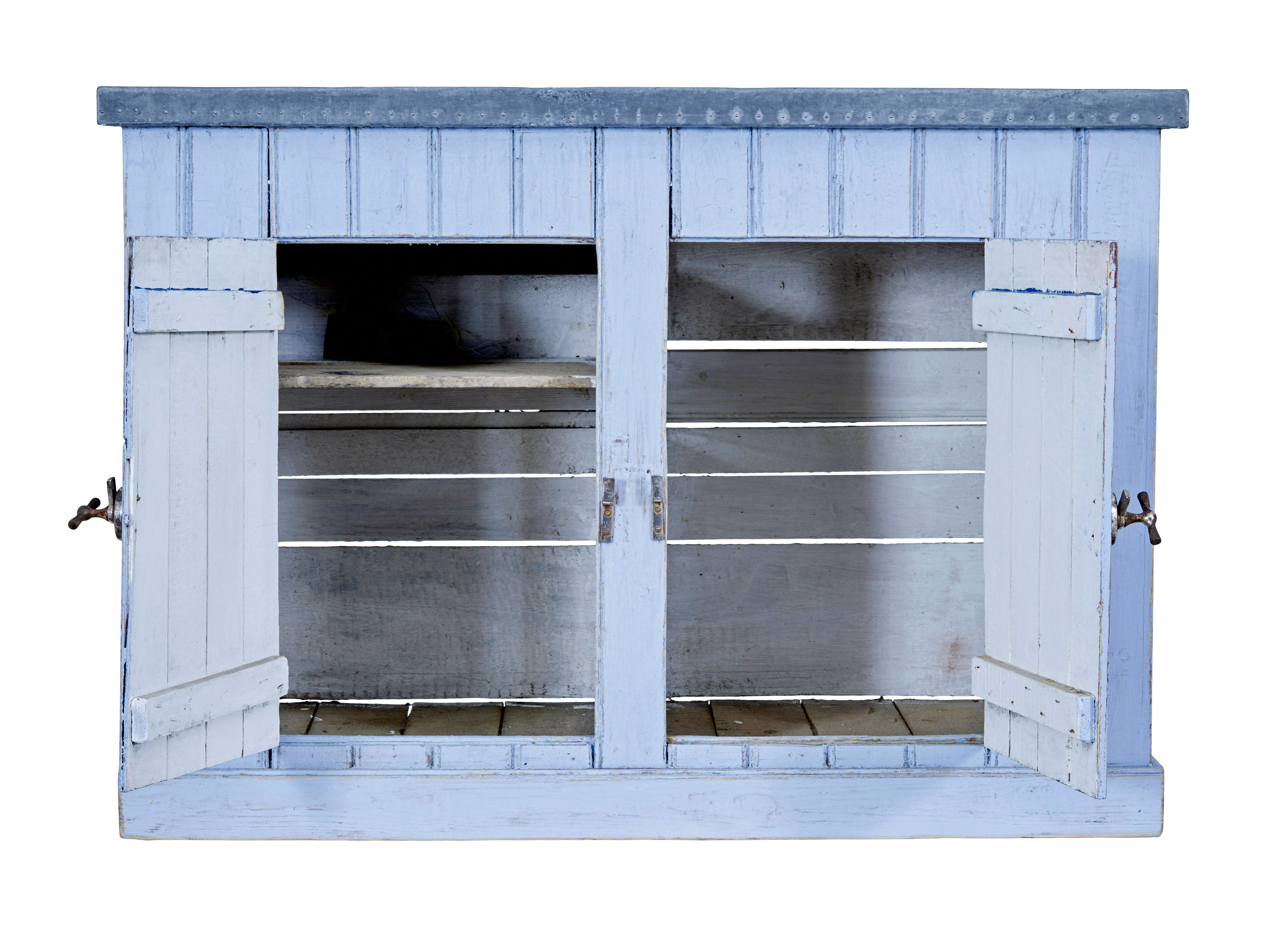 Rustic 19th century pine washstand circa 1890.

Rustic made Swedish washstand, with zinc lined top to stop water damage, double door cupboard opens to reveal an interior of a single shelf.

Later powder blue paint.  Tap heads for handles, this piece