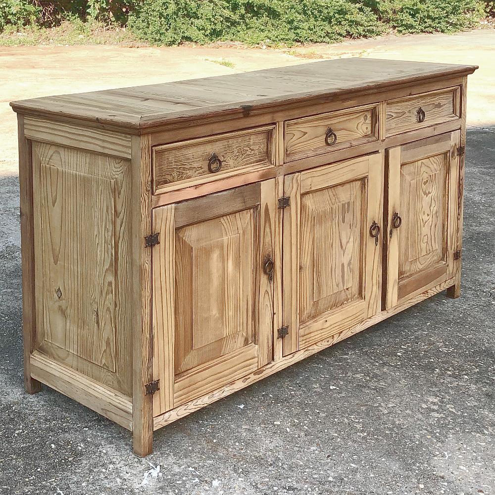 Rustic 19th century Swedish stripped pine low buffet, credenza is a no-nonsense approach to fine furniture with hearty construction techniques melded with old world craftsmanship to produce instant family heirloom pieces! Ideal for the office behind