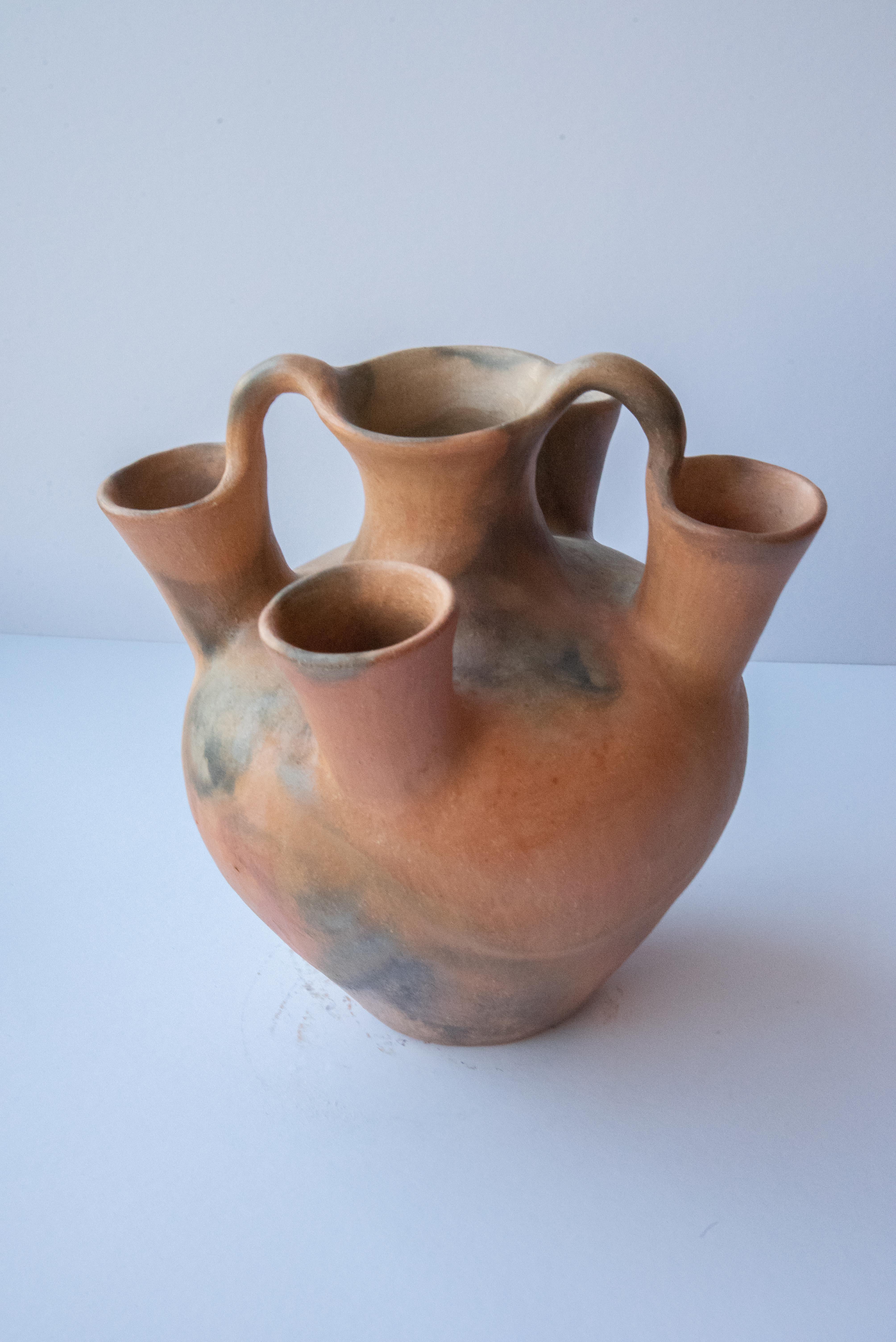 This impressive 4 mouth vessel is a one of a kind piece by master artisan Silvia Martínez. A representation of the folk art of Oaxaca, in Mexico, this special water container is made from clay from the region and burned in a traditional oven. The