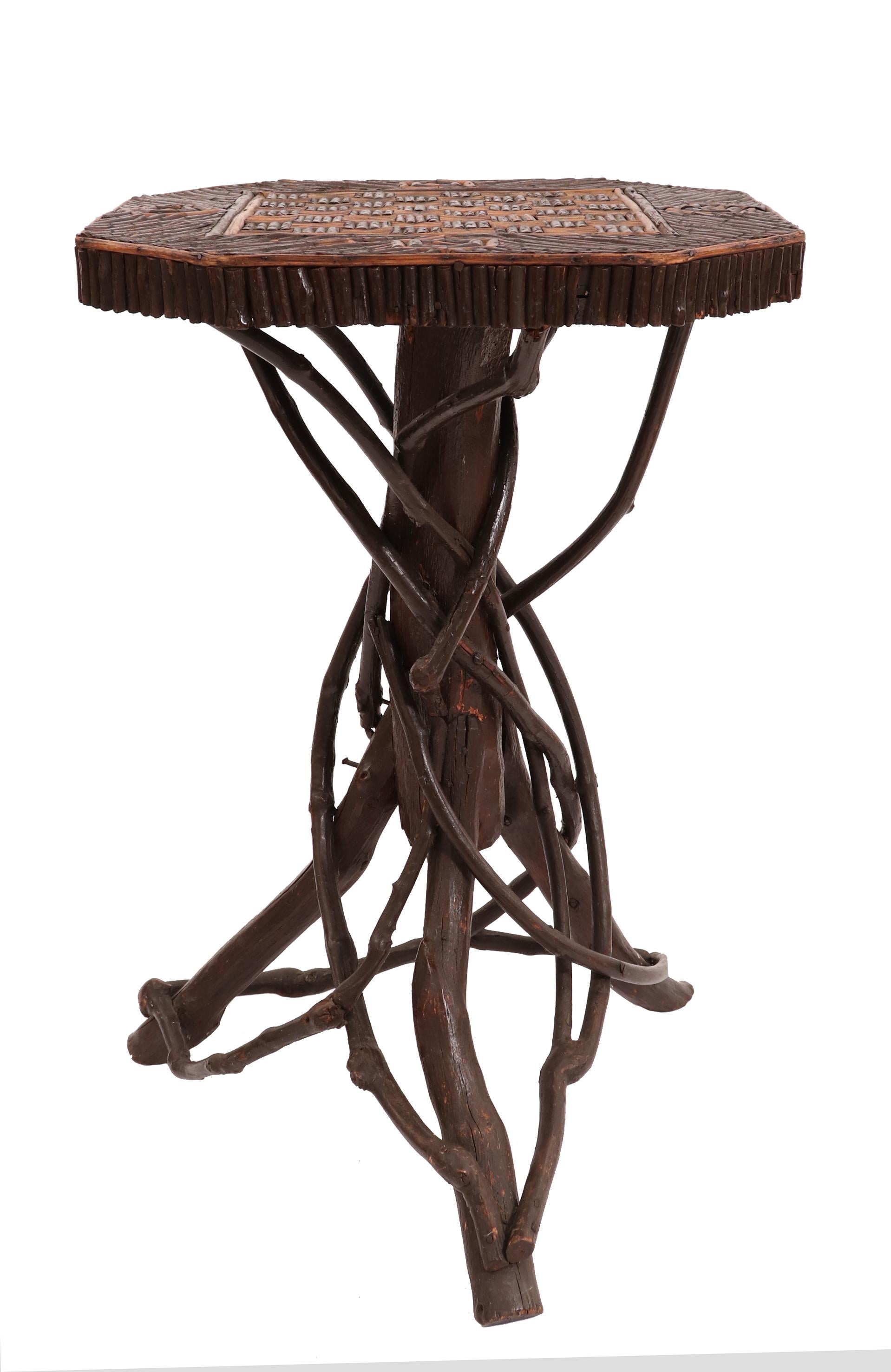 Rustic Adirondack style twig and wood game table with natural branch base and inlaid twig game board tabletop.