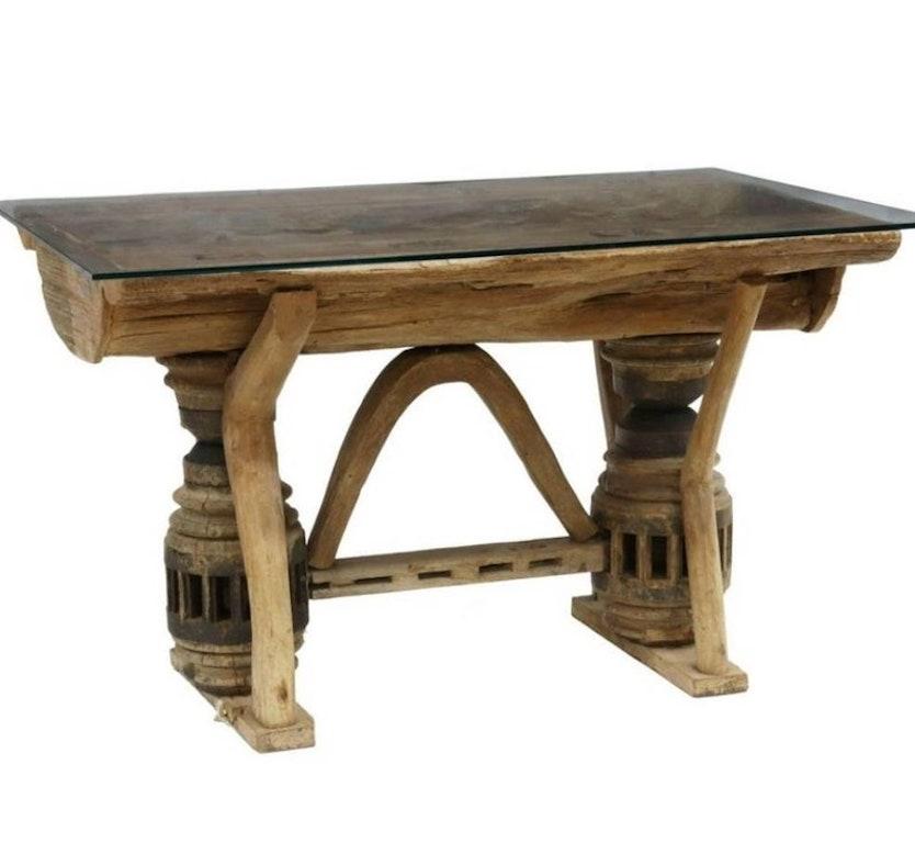 A custom rustic Adirondack style table, born in the 20th century, handcrafted of authentic antique elements including 19th century wagon wheel hubs and reclaimed salvaged timber. 

Topped with a very thick and high quality rectangular glass top,