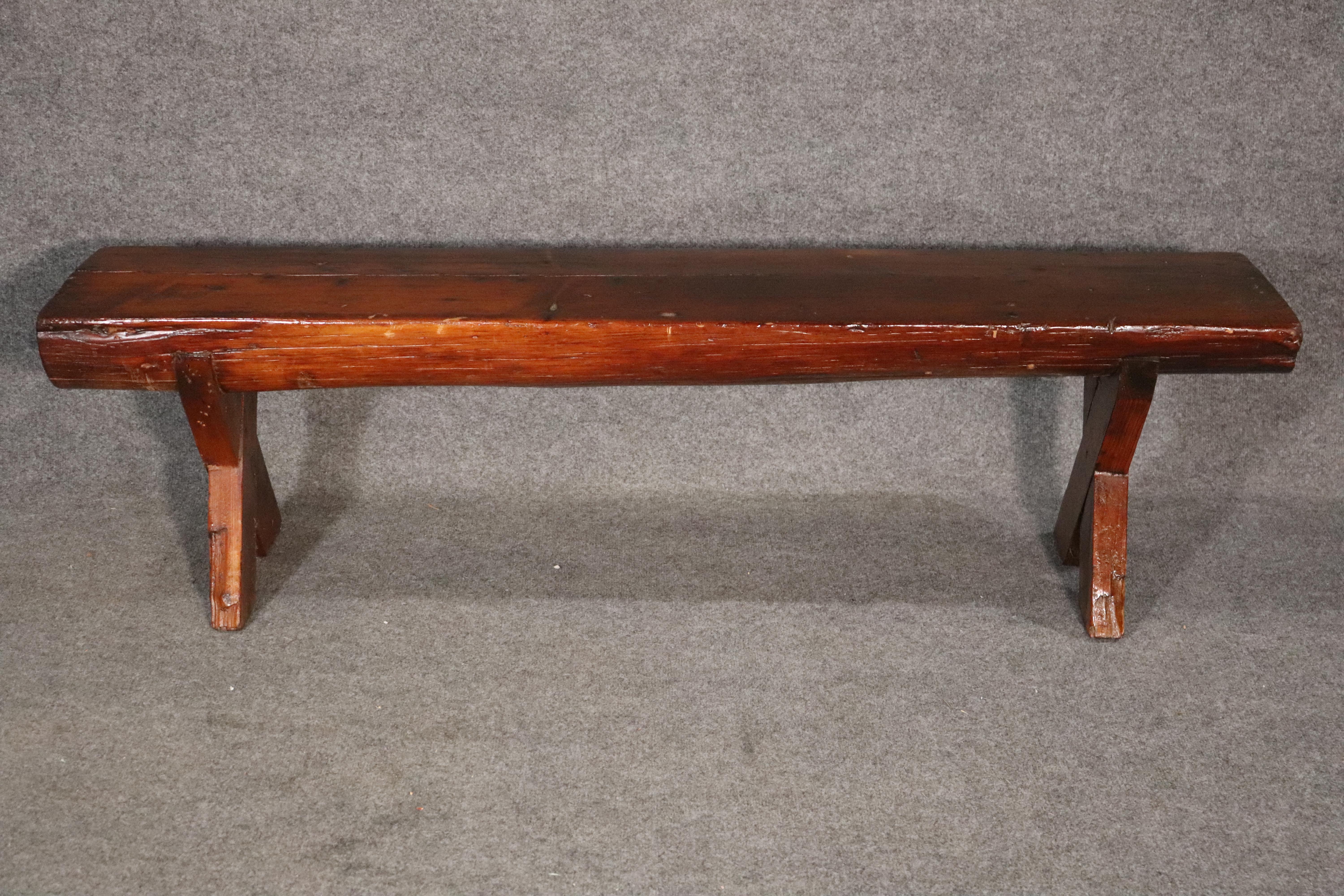 Long 5 foot wood bench with criss-cross legs. Created by hand using a half log set on sturdy x-frame legs. Great for use indoor or outside.
Please confirm location NY or NJ.