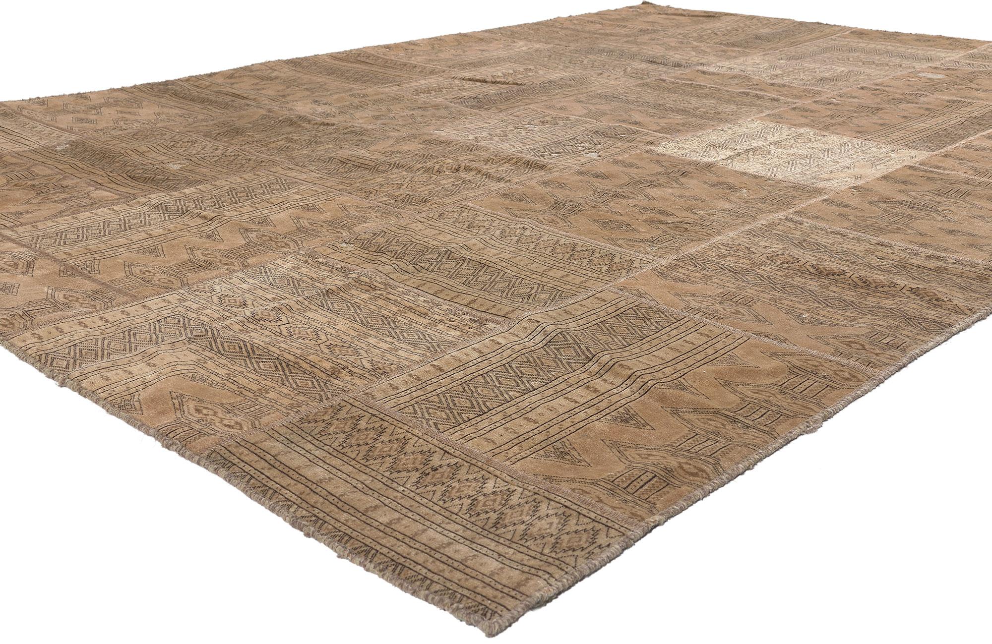 78587 Vintage Persian Patchwork Rug, 06'10 x 09'10. 
Emanating masculine appeal and nomadic charm, this vintage Persian patchwork rug is a captivating vision of woven beauty. The Tekke designs and earthy colorway woven into this piece work together