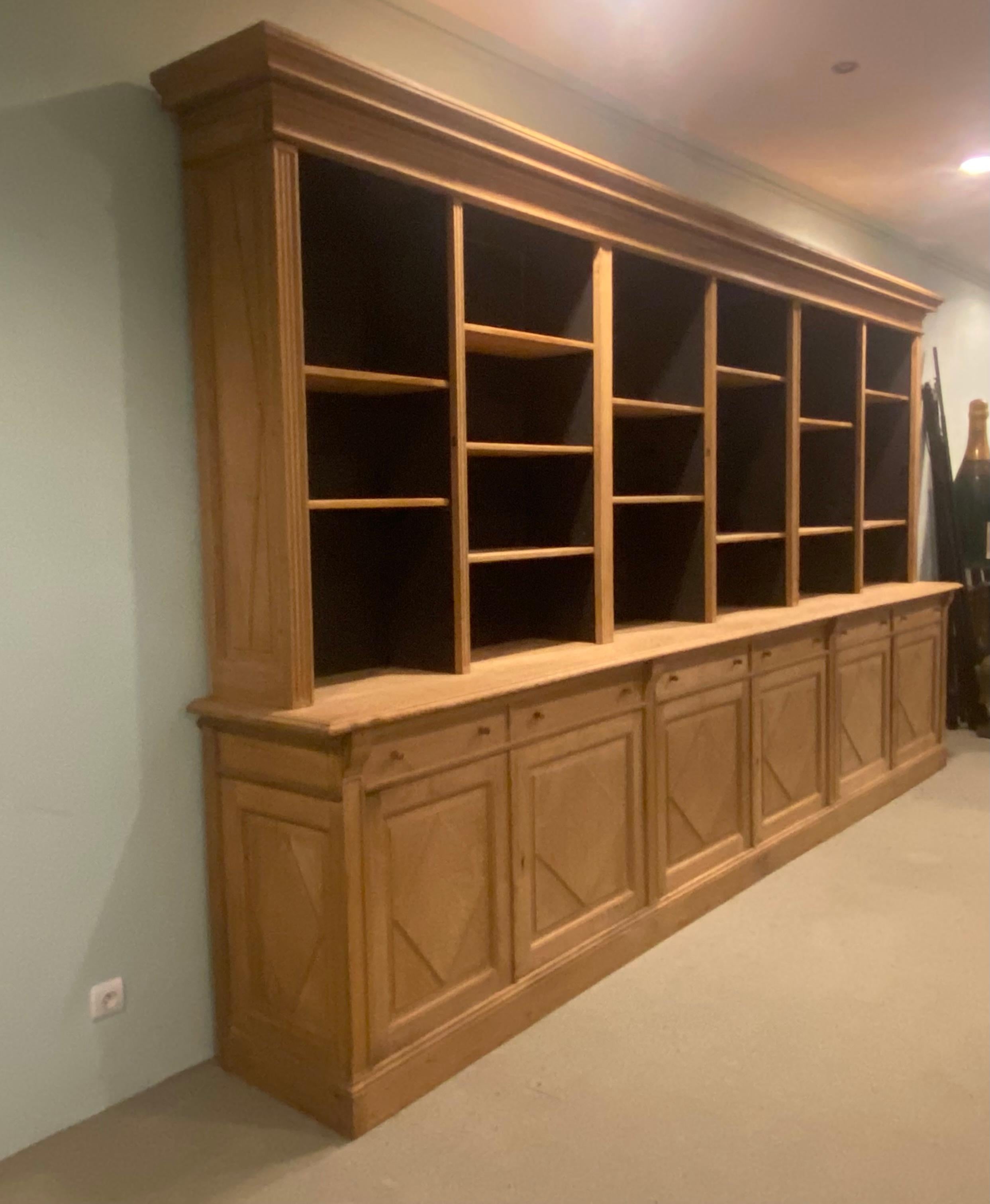 Exceptional Wide Bookcase of 413 cm wide and only 229 cm high, high quality bleached Oak Wood,

from a Notary Cabinet in the north Of France,

made to order around 1900, with glazed doors, to be used or without doors is also a beautiful