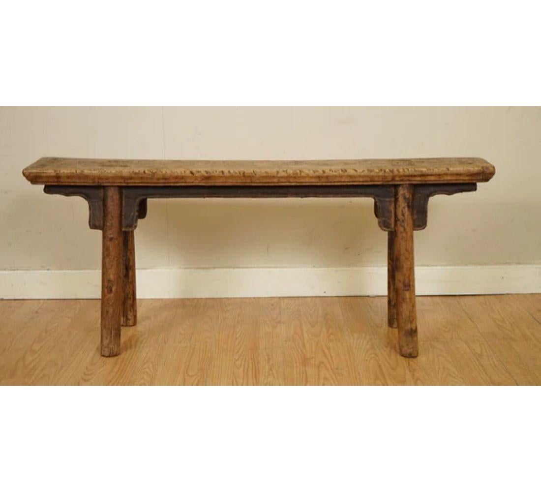 We are delighted to offer for sale this stunning Qing antique Rustic Chinese Elm bench from Jiangsu Province circa in the 1900s.

A classic two-person bench, carved of the elm species of wood with great patina and wear to its surface.

Elegantly