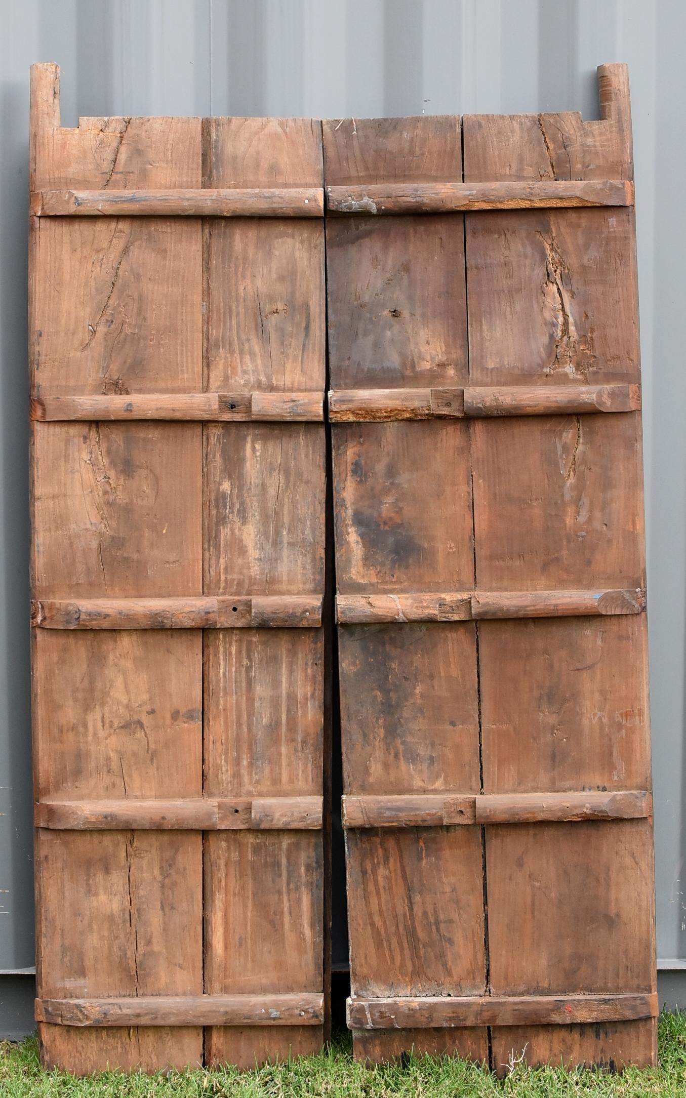 Rustic Antique Doors with Brass Knockers 6