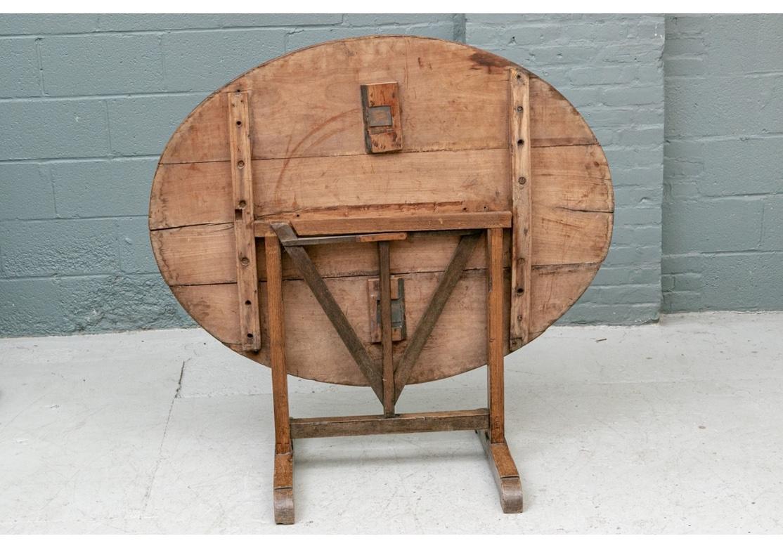 Rustic Antique French Tilt Top Vintner’s Table In Distressed Condition For Sale In Bridgeport, CT