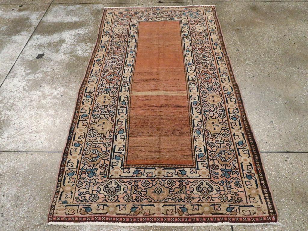 A rustic antique Persian Malayer small accent rug handmade during the early 20th century.

Measures: 3' 6