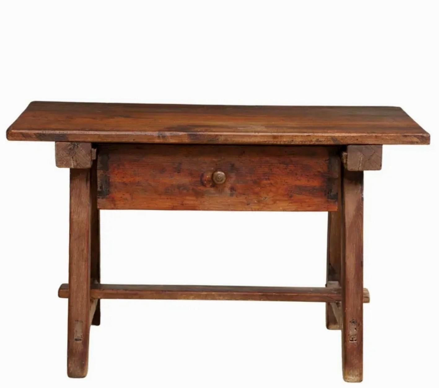 A rustic 200+ year old antique Spanish Colonial Baroque style work table with nicely aged patina.

Born in the late 18th / early 19th century, primitive hand-crafted mortised construction, having a rectangular plank top, single frieze drawer with